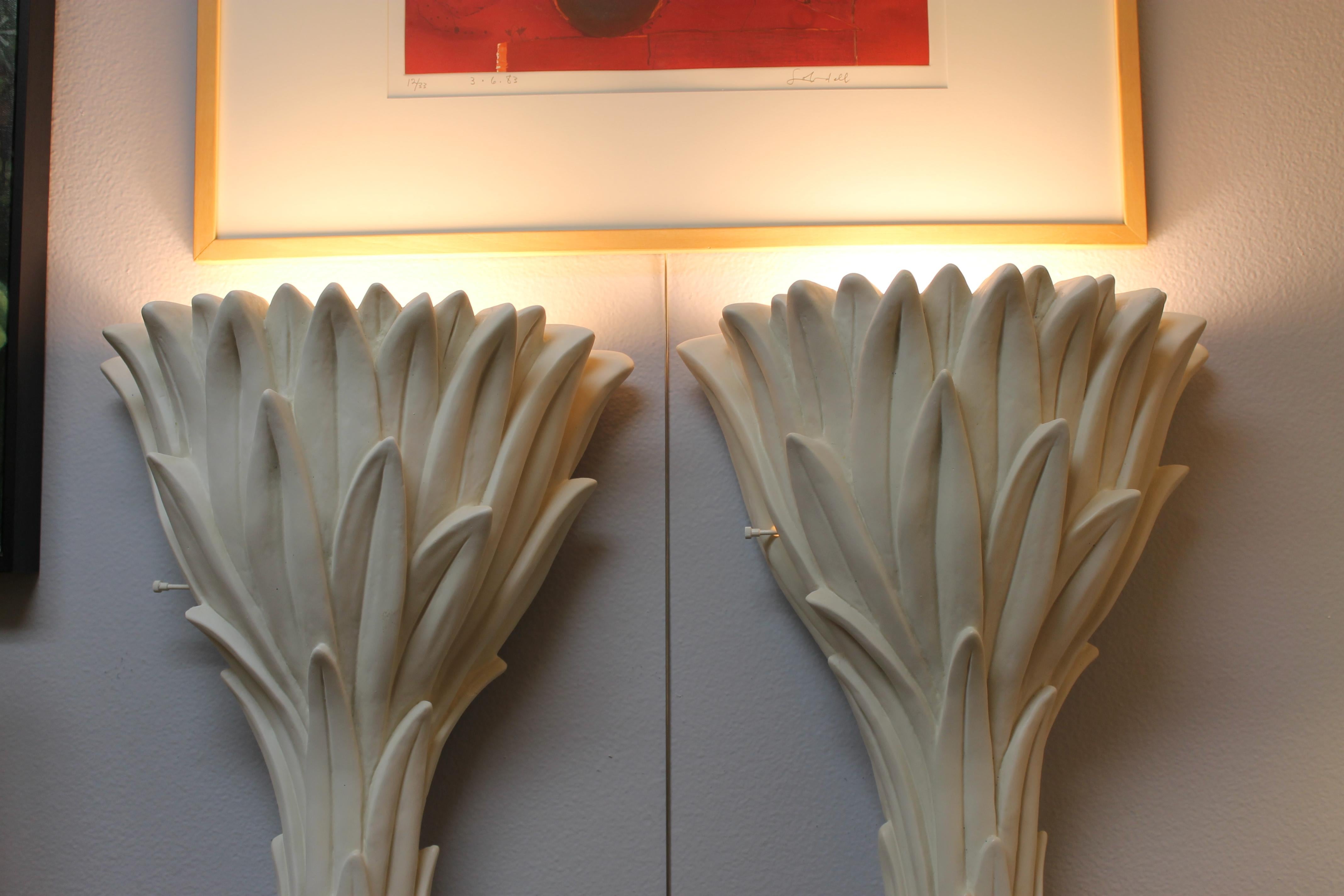 Pair of plaster foliate torcheres by Serge Roche. These pair are the rare wall-mounted versions. Frances/Francis Elkins along with other interior designers used these when furnishing their interiors. They measure 18