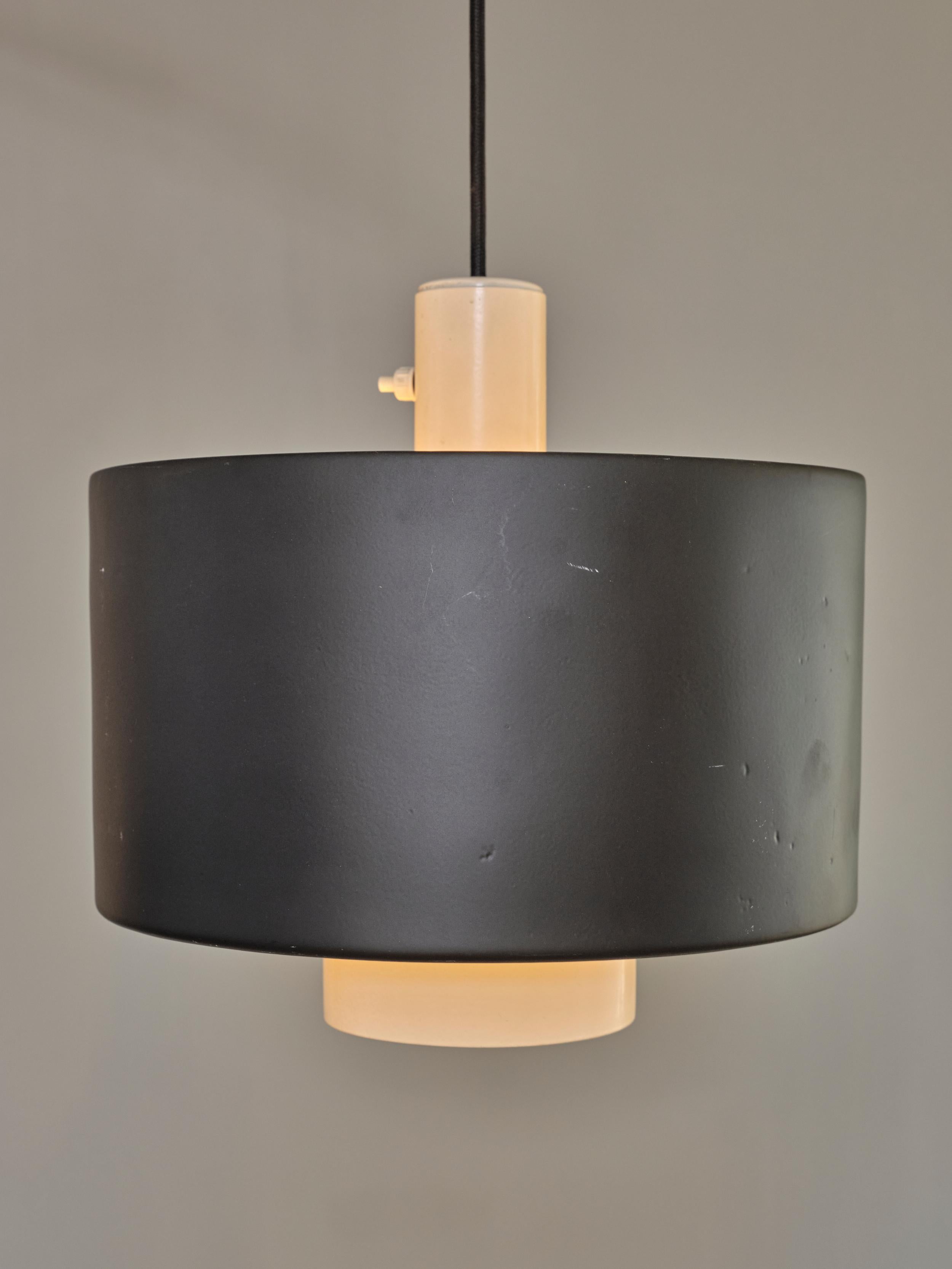 Wall Mounted Pendant Lamp designed by the renowned Italian designer, Gaetano Sciolari and produced by Stilnovo crafted with a combination of metal and brass elements. The wall-mounted pendant design allows this lamp to extend from the wall, casting