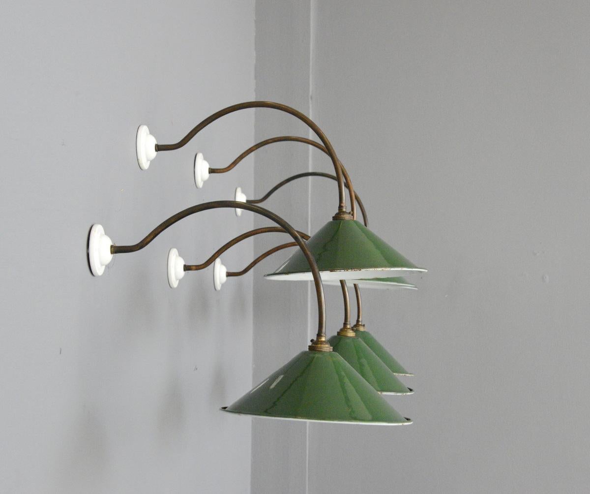 Wall mounted porcelain and copper lights, circa 1920s

- Price is per light (9 available)
- Vitreous green enamel shades
- Porcelain wall brackets
- Oxidized copper arms
- Takes B22 fitting bulbs
- English, 1920s
- Measures: 26cm wide x 26cm