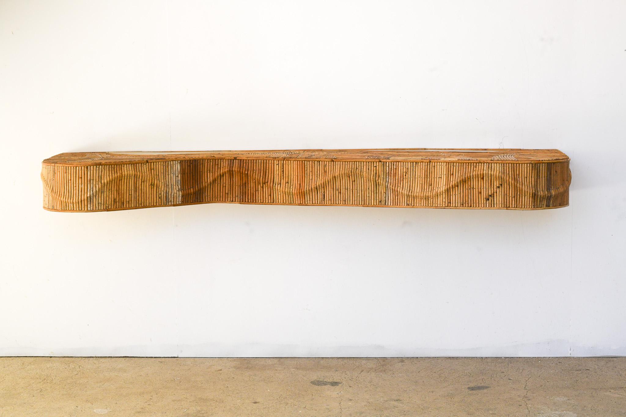 Handcrafted Organic Rattan Console Table with Intricate Leaf Motifs & Patinated Brass Accents

Elevate your space with this exquisite, one-of-a-kind wall-mounted console table. Meticulously crafted from organic pencil reed rattan, its surface
