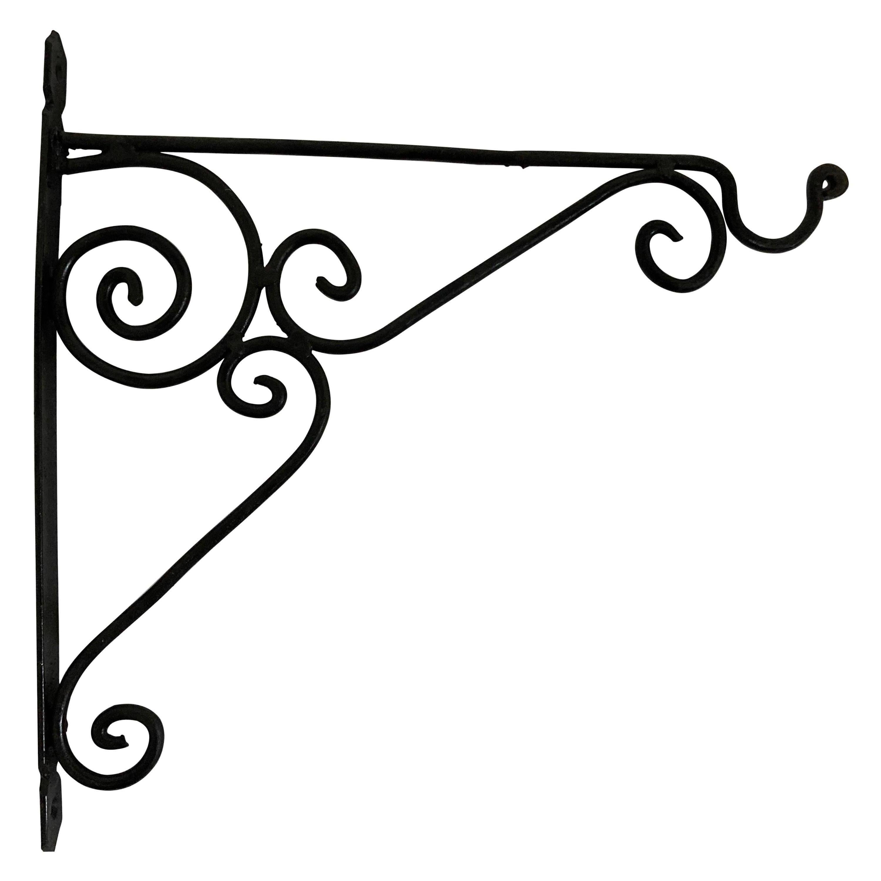 Hand crafted iron scroll design wall bracket. 
Wrought iron handcrafted wall-bracket for lanterns or signs.
Perfect for hanging lights or plants outdoors.
Scrolling wall-mounted brackets.
Multiple available.
Dimensions: Projection: 12