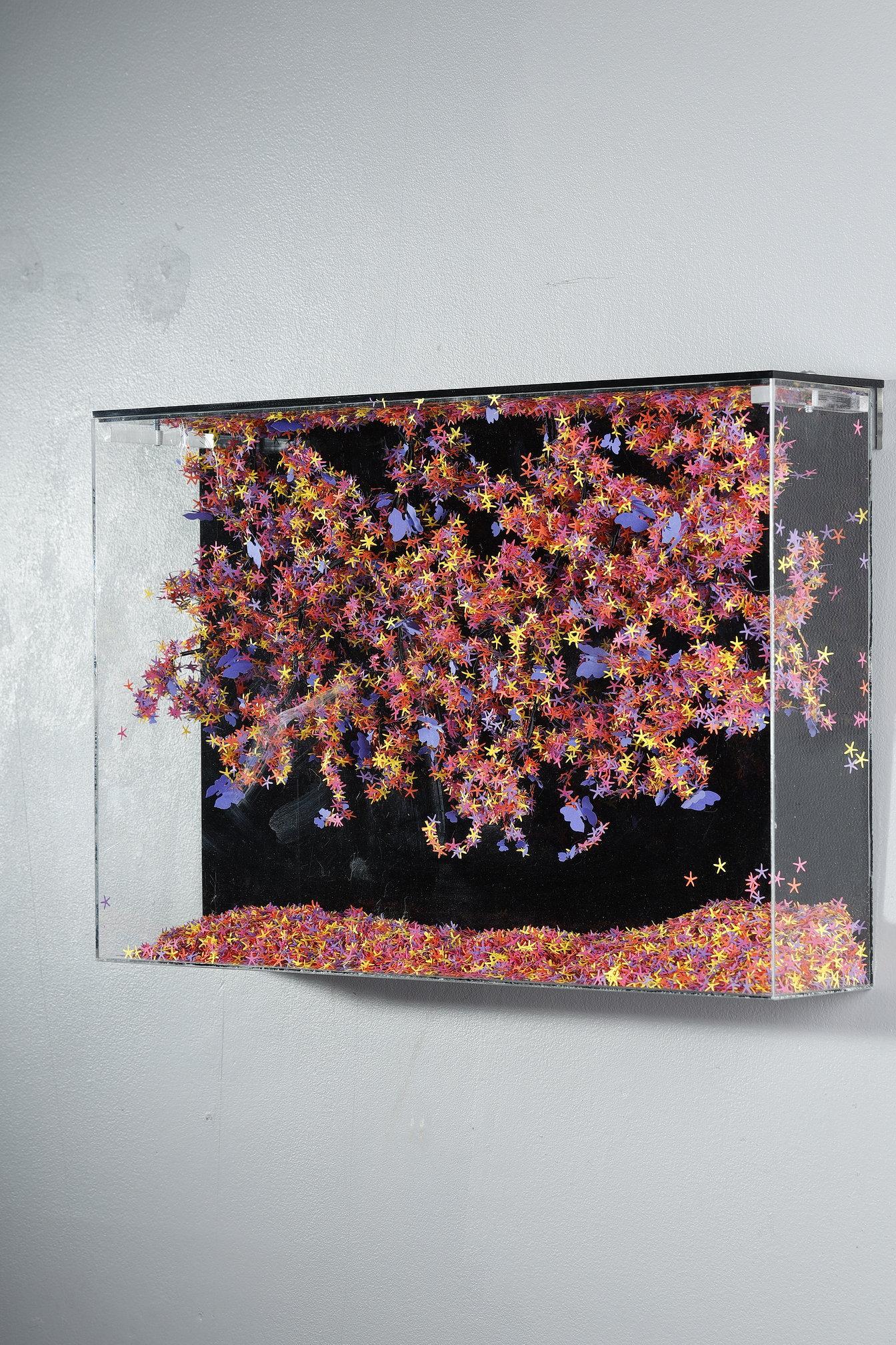 This unique piece by Lebanese artist Nayla Tabet is a wall-mounted sculpture combining high-quality metal wires and finely cut paper in a variety of colors, creating a one-of-a-kind work of art. The artist likes to explore the contrast between the