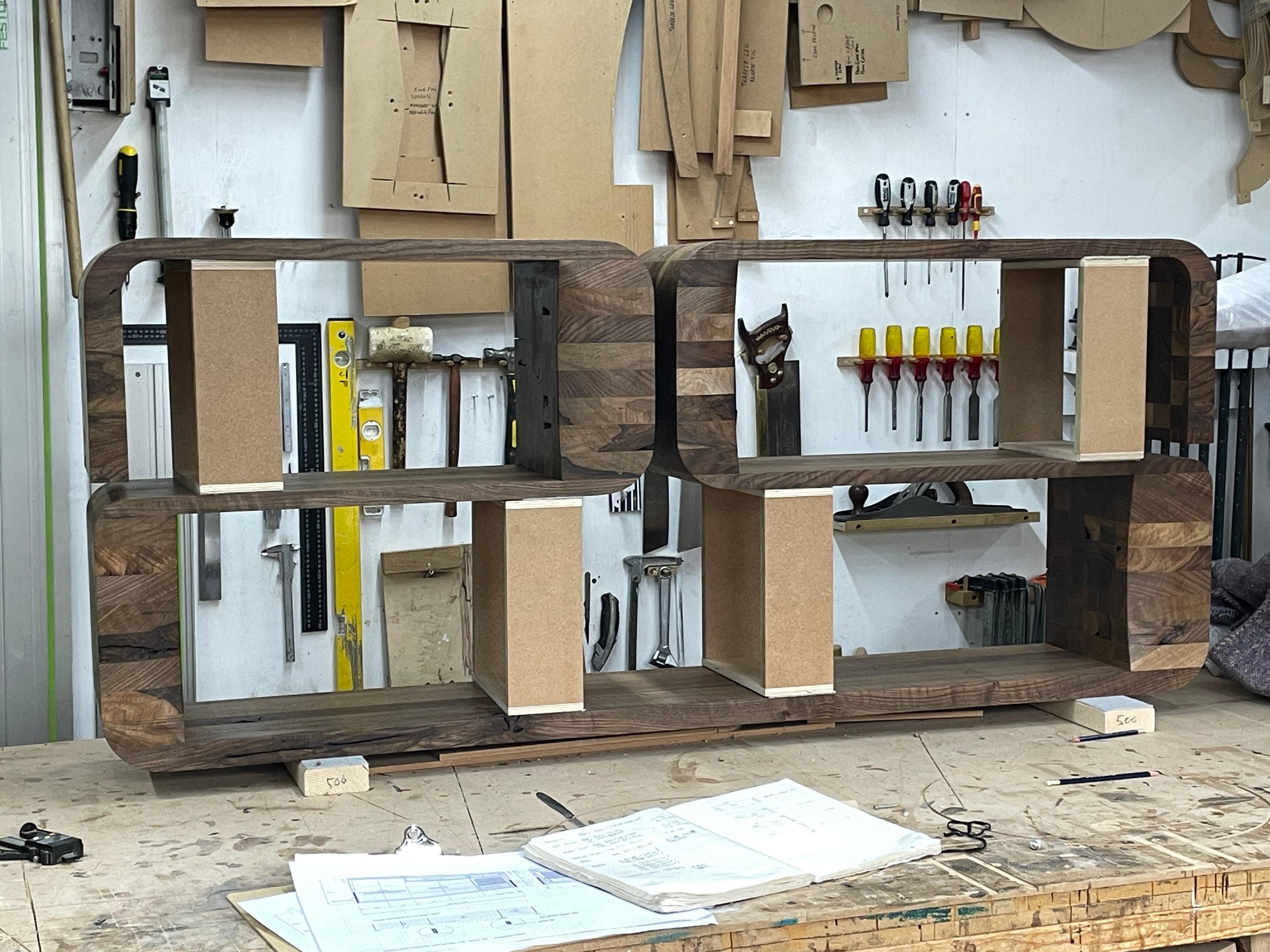 Modern Wall mounted shelving unit in solid walnut by Jonathan Field For Sale