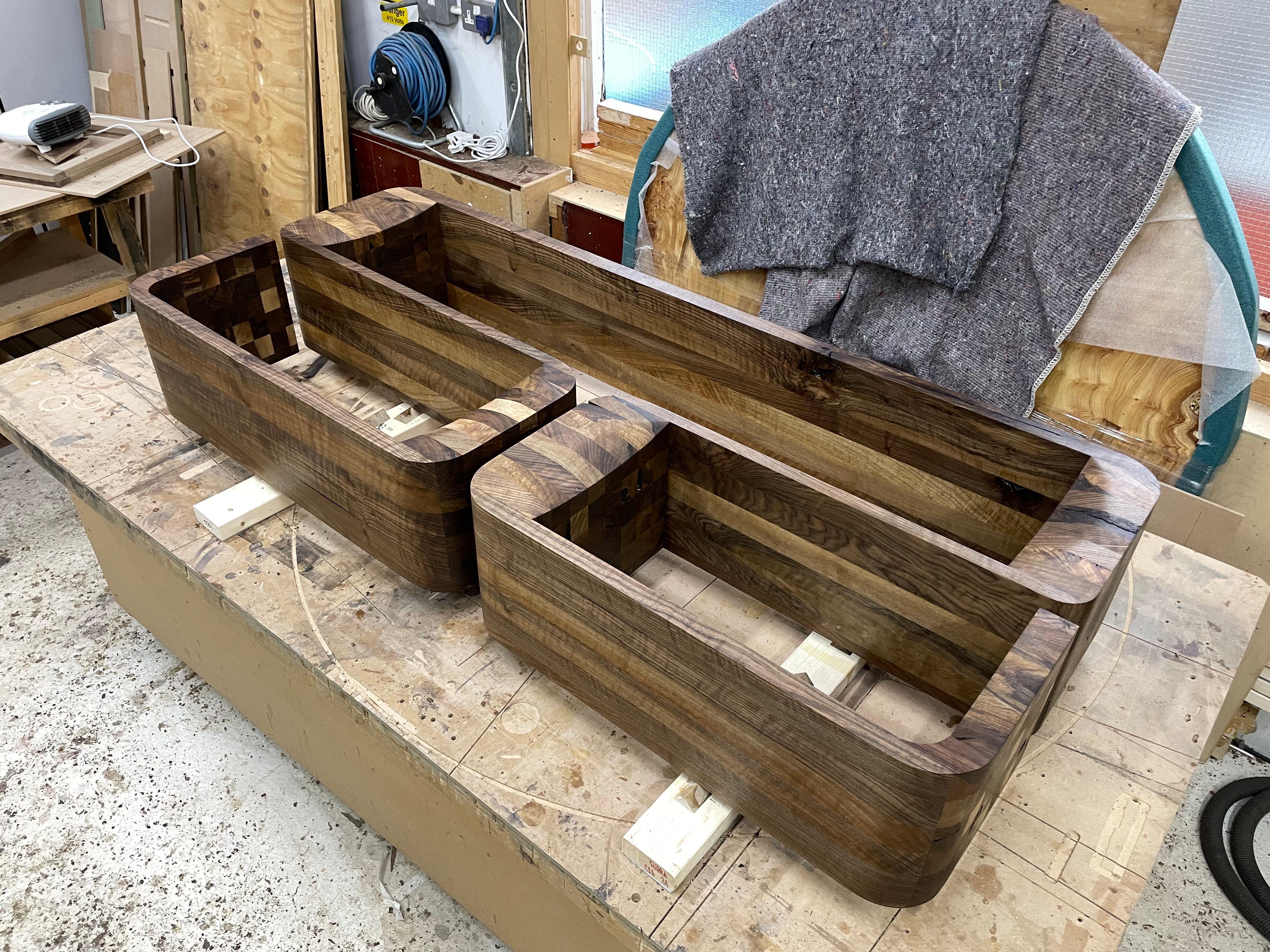 English Wall mounted shelving unit in solid walnut by Jonathan Field For Sale