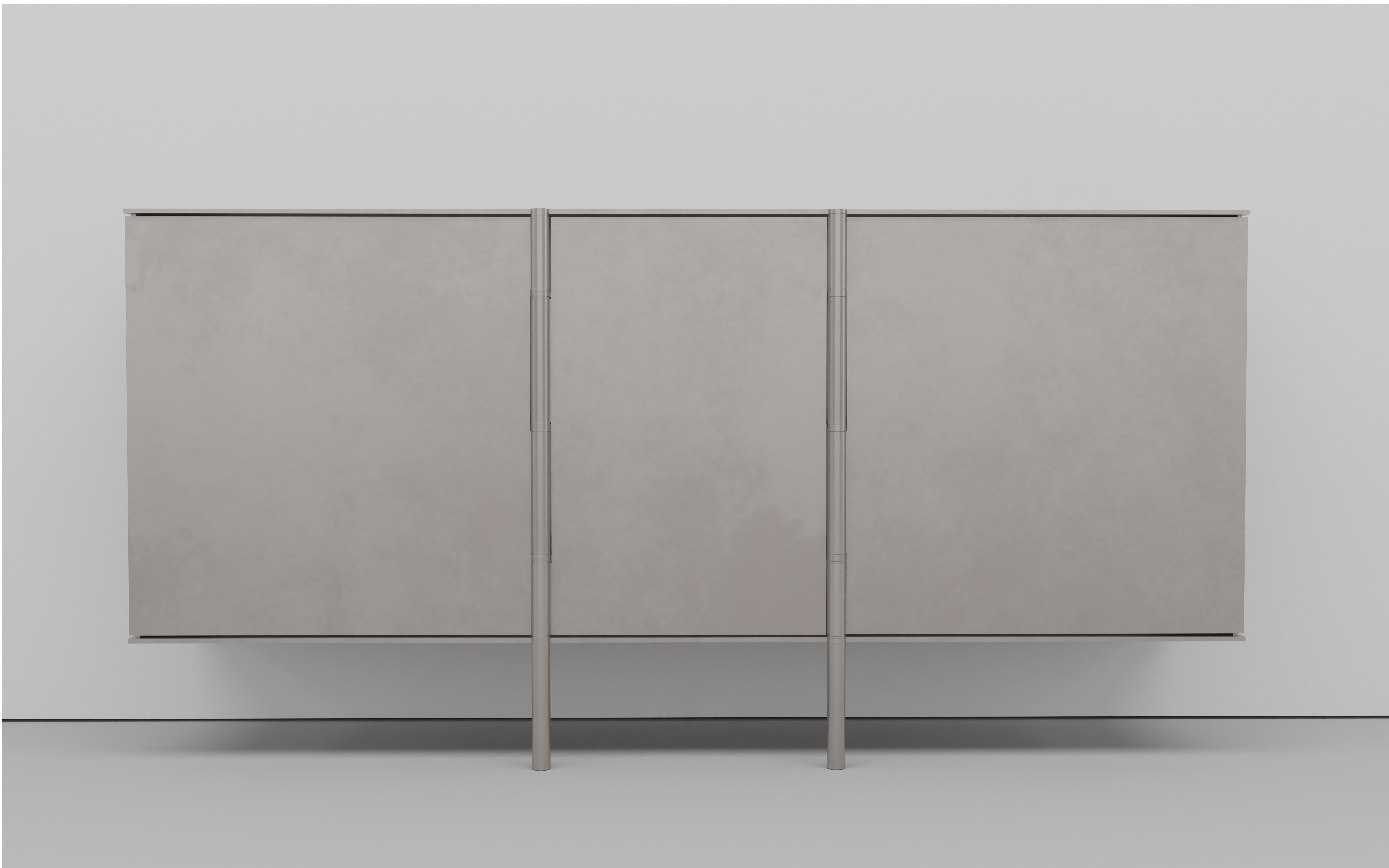 Side Board Cabinet in quarter inch thick aluminum. Made originally as storage for a New York architect's family's board game collection. The doors have custom integrated hinge that align to the interior shelves and extend to an internal foot leveler