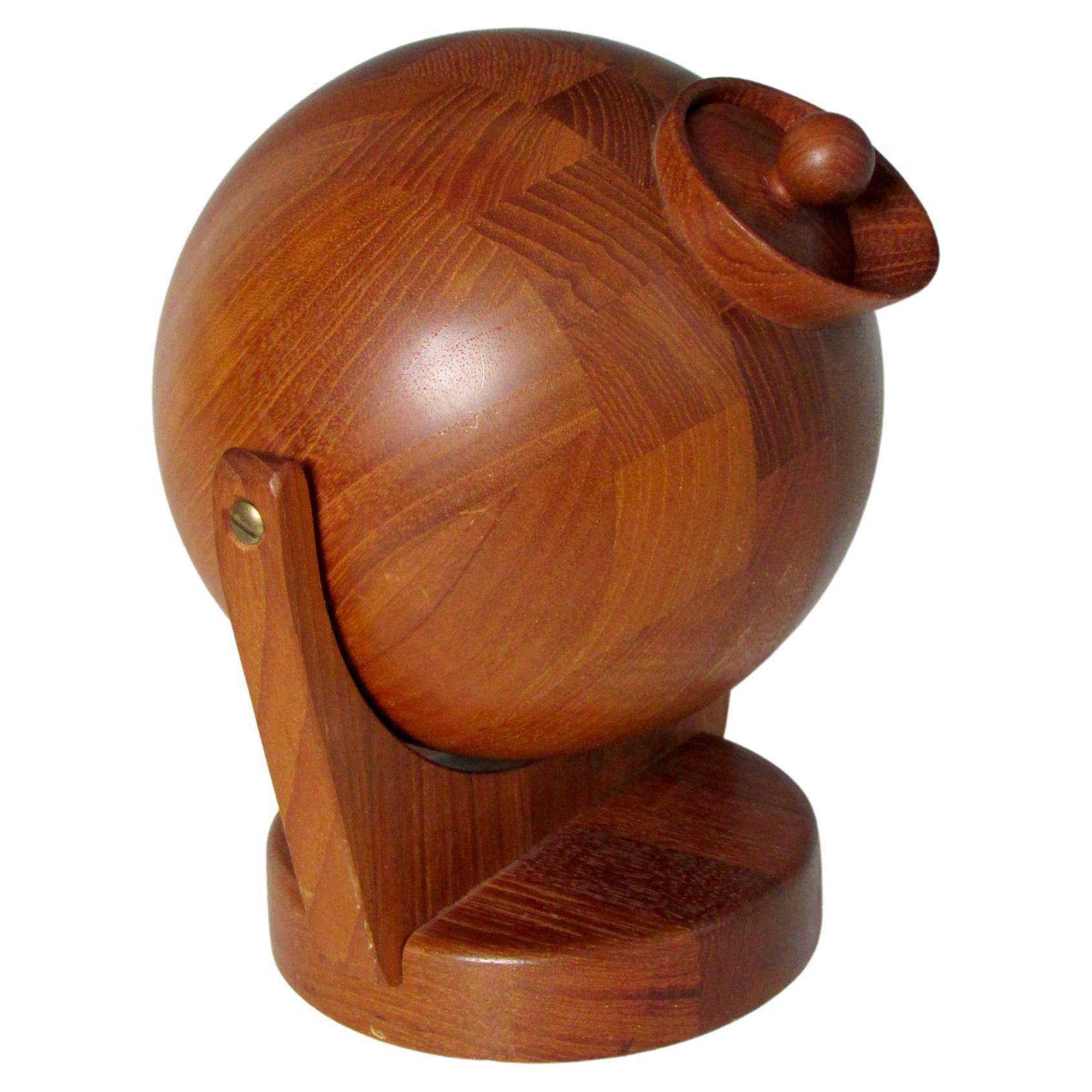 Rarely seen wall mounted teak salt ball. Wood base hooks to wall lathe turned teak wood ball swivels to pour or scoop out salt. Marked ESA Denmark.