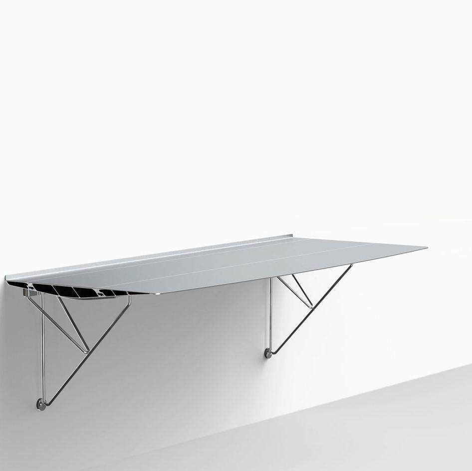 Wall Mounted table B desk by Konstantin Grcic
Dimensions: D 42 x L 180 cm 
Materials: Stainless Steel
Also available in Oak, Stained Ash Wood.


This piece, rather than dating, has always looked to the future. Now it has turned into a series