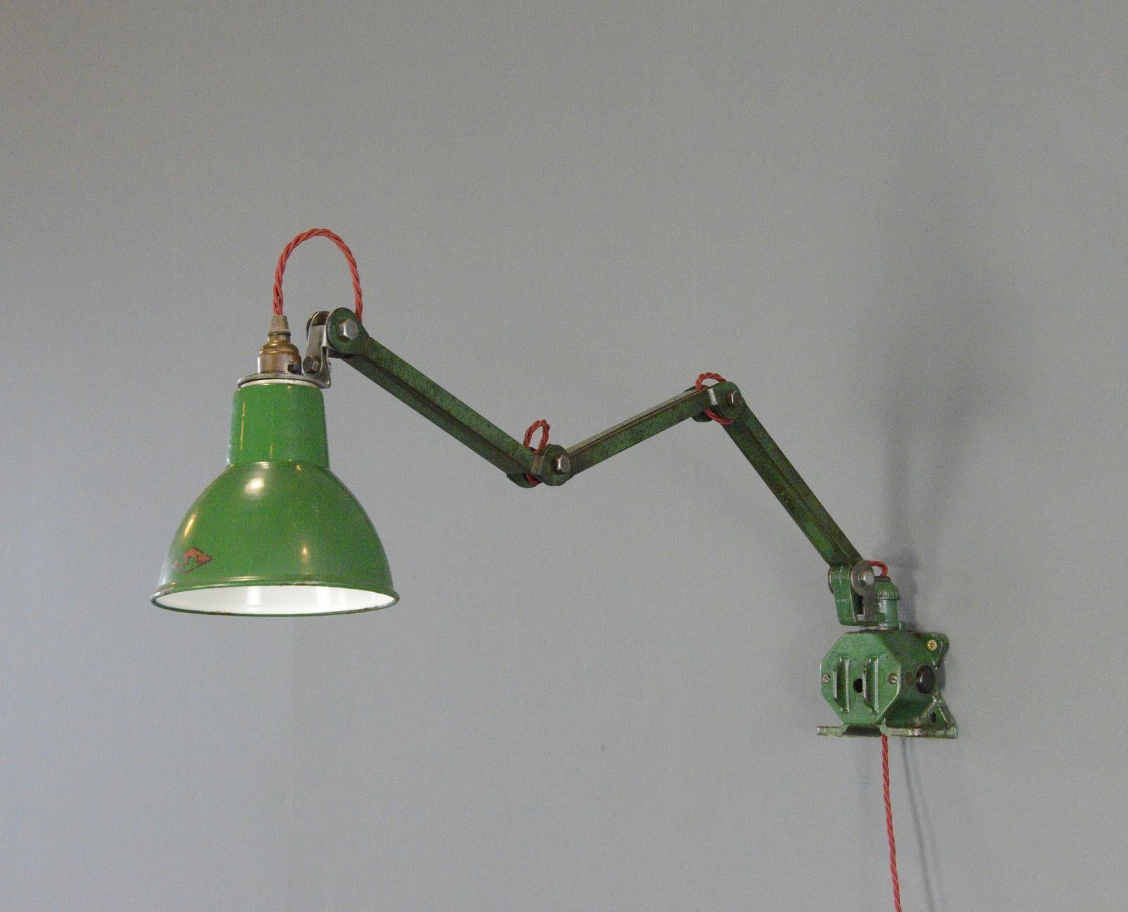 Wall Mounted Task Lamp By EDL Circa 1930s

- Vitreous green enamel shade
- Articulated arms and shade
- Takes B22 fitting bulbs
- On/Off switch on the shade
- Made by EDL, Stafford
- English ~ 1930s
- 15cm wide 
- Extends up to 125cm from the