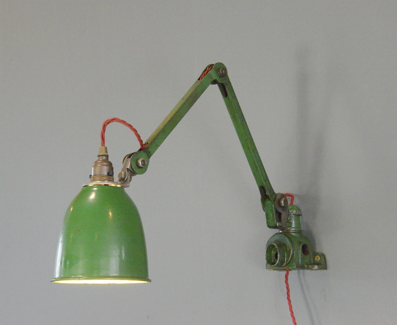 Wall Mounted Task Lamp By EDL Circa 1930s

- Vitreous green enamel shade
- Articulated arms and shade
- Takes B22 fitting bulbs
- On/Off switch on the shade
- Made by EDL, Stafford
- English ~ 1930s
- 15cm wide 
- Extends up to 125cm from the