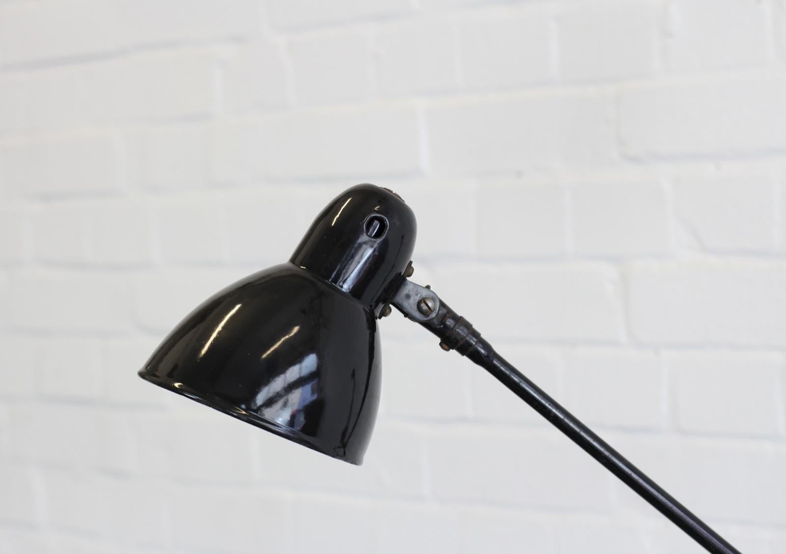 Wall-mounted task lamp by Jacobus, circa 1930s

- Vitreous black enamel shade
- 3 articulated arms
- Takes E27 fitting bulbs
- Inline switch near the wall mount
- German, circa 1930s
- Shade measures 15cm wide
- Extends up to 125cm from the