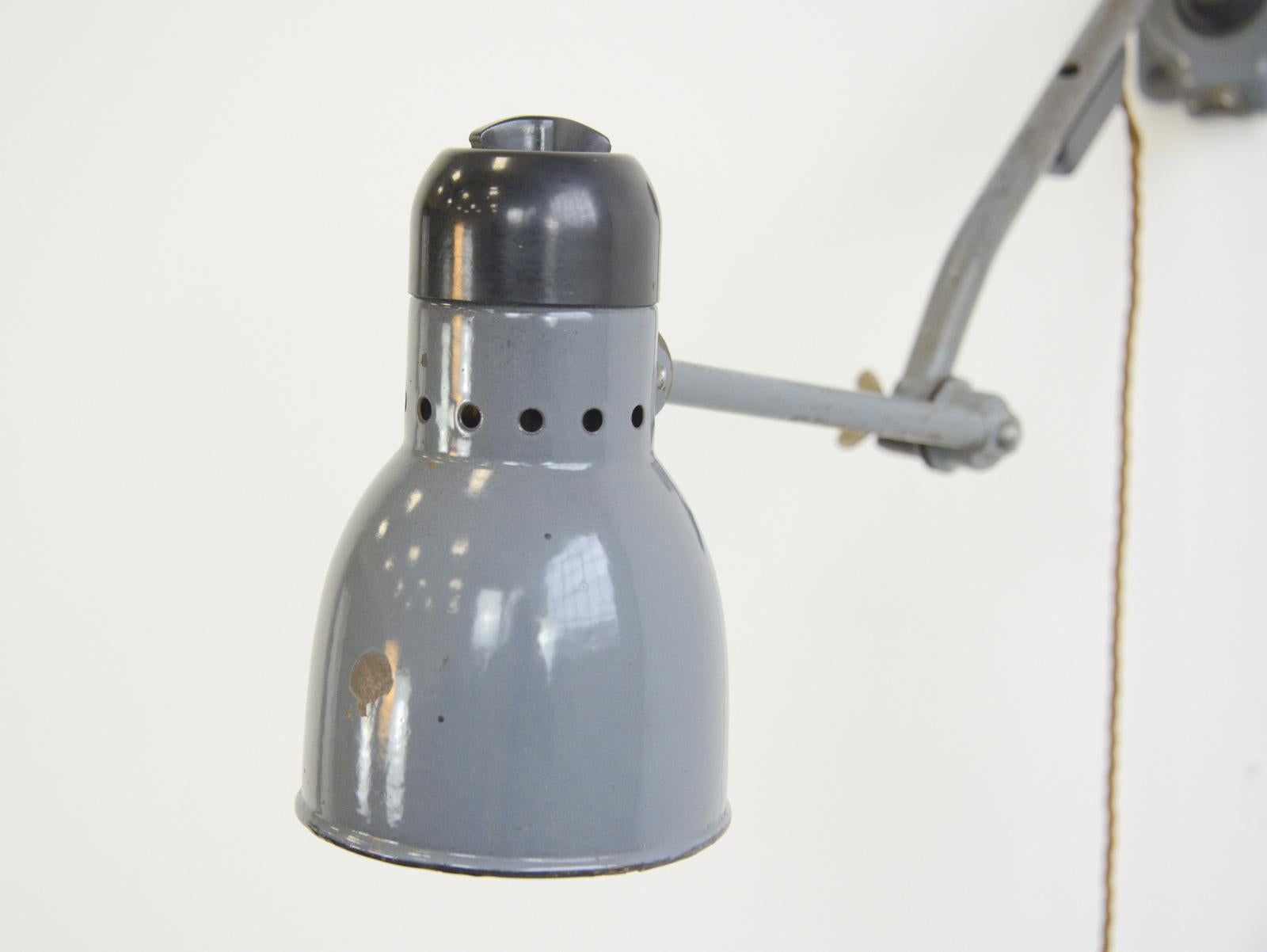 Wall-mounted task lamp by Kandem, circa 1930s

- Vitreous grey enamel shade
- Bakelite switch and head
- Branded Kandem on the Bakelite top
- Takes E27 fitting bulbs
- Made by Korting & Mathiesen
- German, 1930s
- Measures: 12cm wide
-