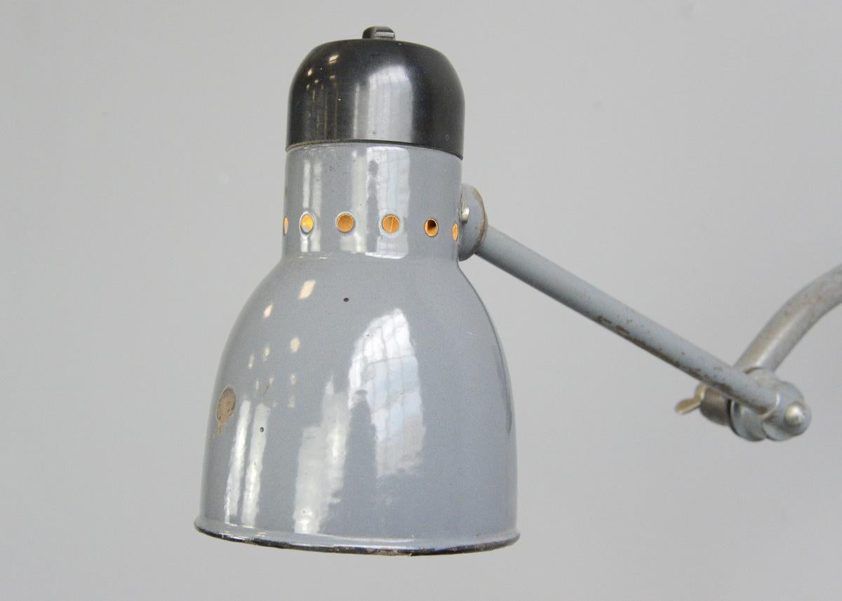 Wall-mounted task lamp by Kandem, circa 1930s

- Vitreous grey enamel shade
- Bakelite switch and head
- Branded Kandem on the Bakelite top
- Takes E27 fitting bulbs
- Made by Korting & Mathiesen
- German, 1930s
- Measures: 12cm wide
-