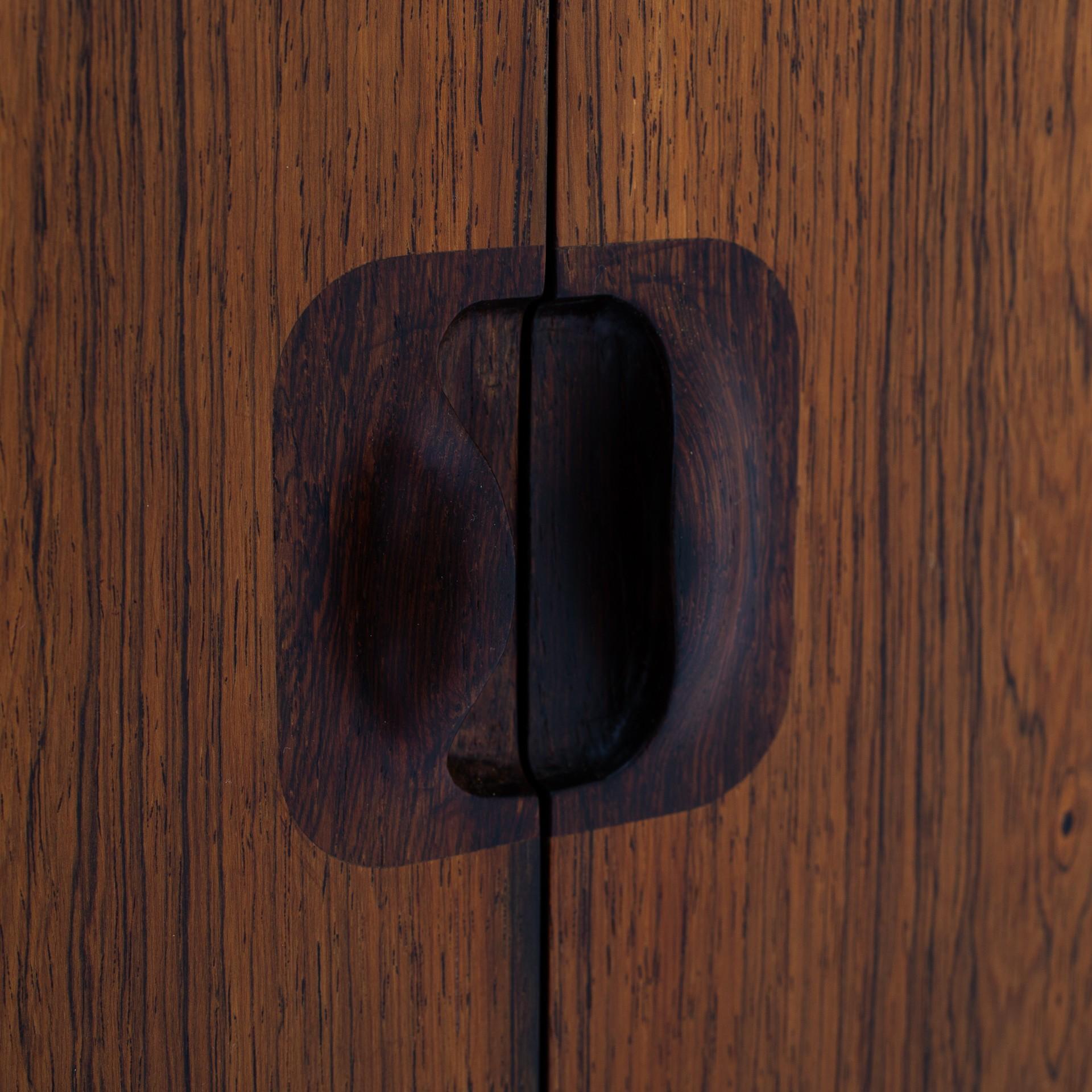 Wall-mounted vanity cabinet in rosewood with mirrors. Designed in 1941. Called 'Young Lady Sought'. Maker Gustav Bertelsen.