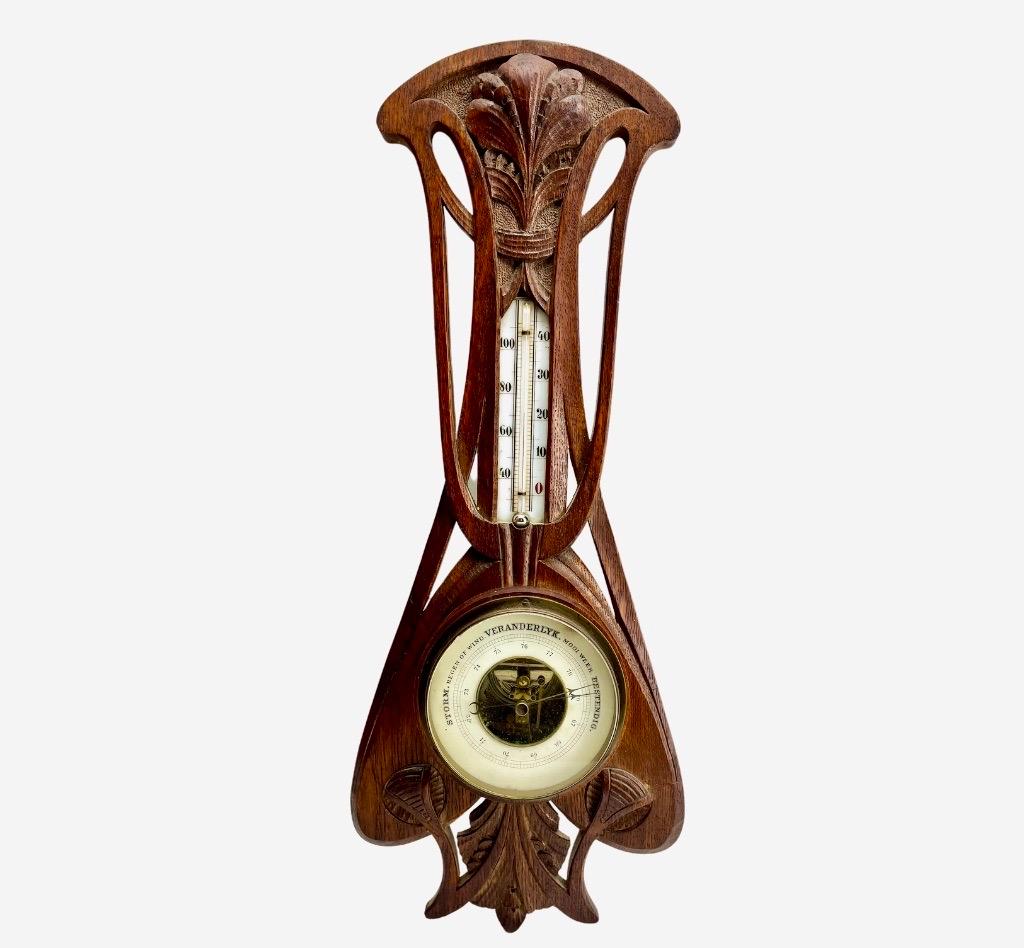 Wall-Mounted Weather Station in Art Nouveau Style Carved Oak  1910s  Belgium
High quality mechanism with jeweled movement barometer and thermometer (in centigrade)
Unusual design with high relief C-scrolls and Flowers
 (from theArt Nouveau' period)