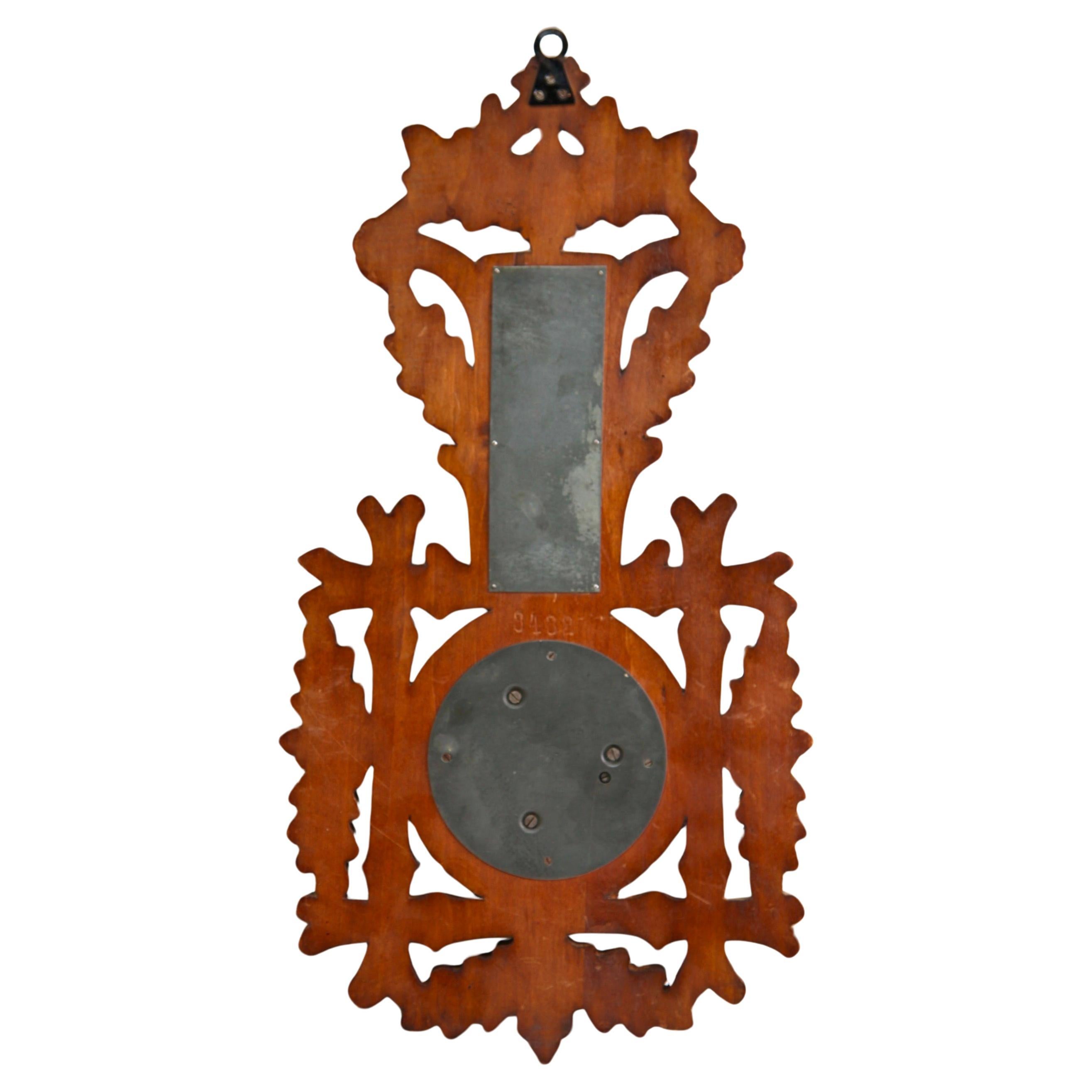 Wall-mounted weather station in carved walnut made in Belgium by A. de Lambert. High quality mechanism with jeweled movement barometer and thermometer (in centigrade)
Unusual design with high relief C-scrolls and flowers in Rococo style (from theArt