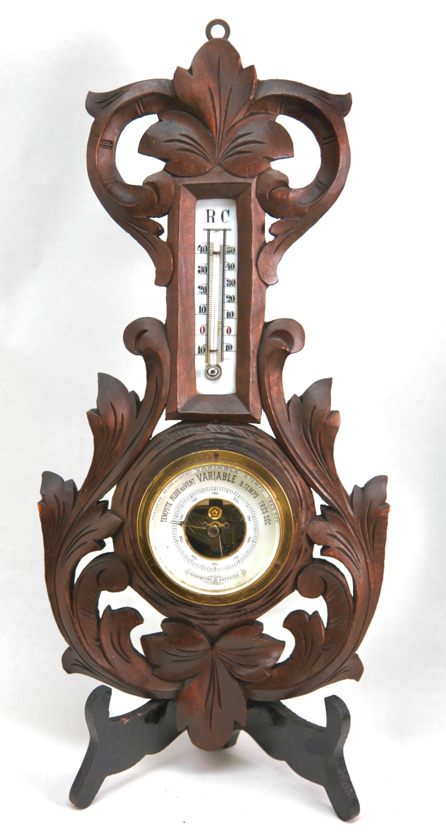 Wall-mounted weather station in carved walnut made in Belgium by A. de Lambert. High quality mechanism with jeweled movement barometer and thermometer (in centigrade)
Unusual design with high relief C-scrolls and flowers in Rococo style (from the