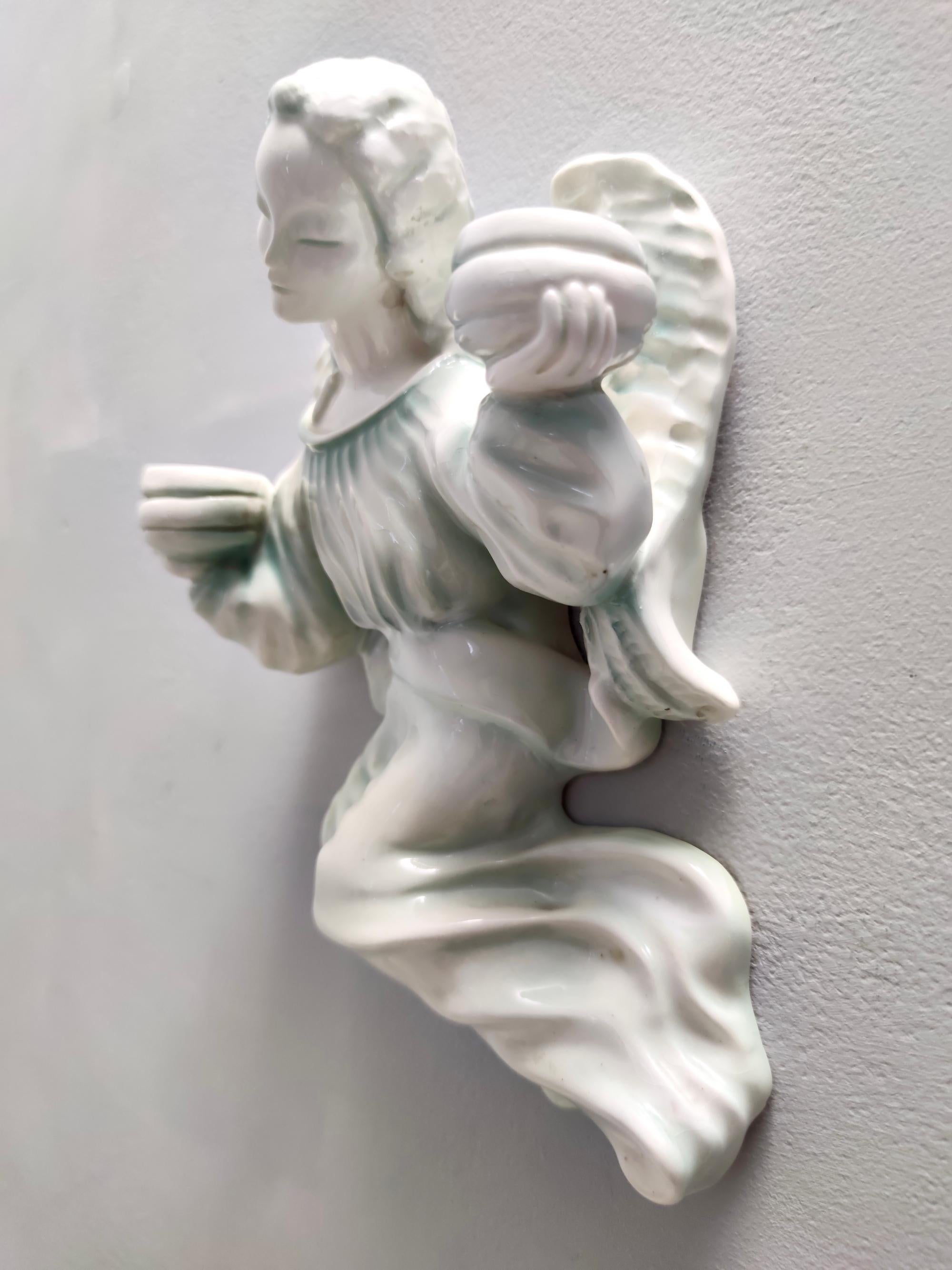 Wall Mounted White Glazed Ceramic Cherub Candleholder by Goldscheider, Austria In Excellent Condition In Bresso, Lombardy