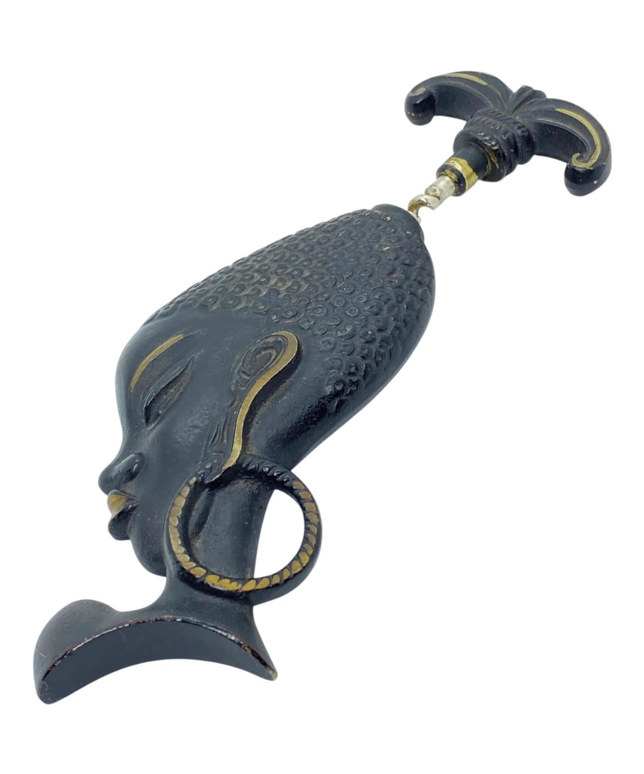 Classic early 1950s Austrian corkscrew in the form of a Woman Head. Has a hook to be attached at the wall. Nice addition to your room, bar or just for your collection of Austrian bronze items. Found at an estate sale in Vienna, Austria.