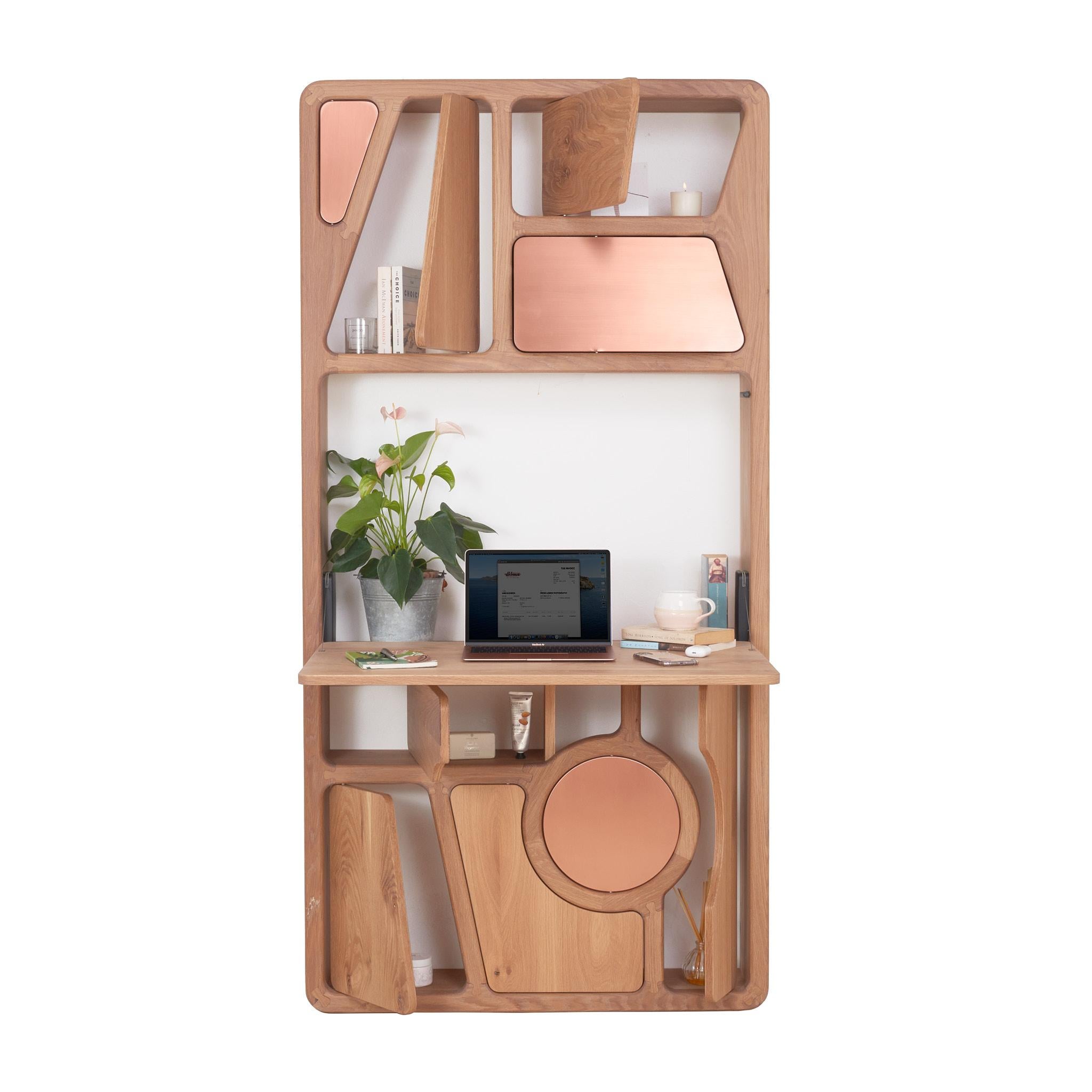 The Wall Office is the epitome of space saving solutions. A unique, handcrafted, fine-furniture item, it takes up only 0.25m^2 of floor space (or 2.6ft^2) 

It is carefully constructed from a mixture of solid wood, soft metals (brass and copper) and