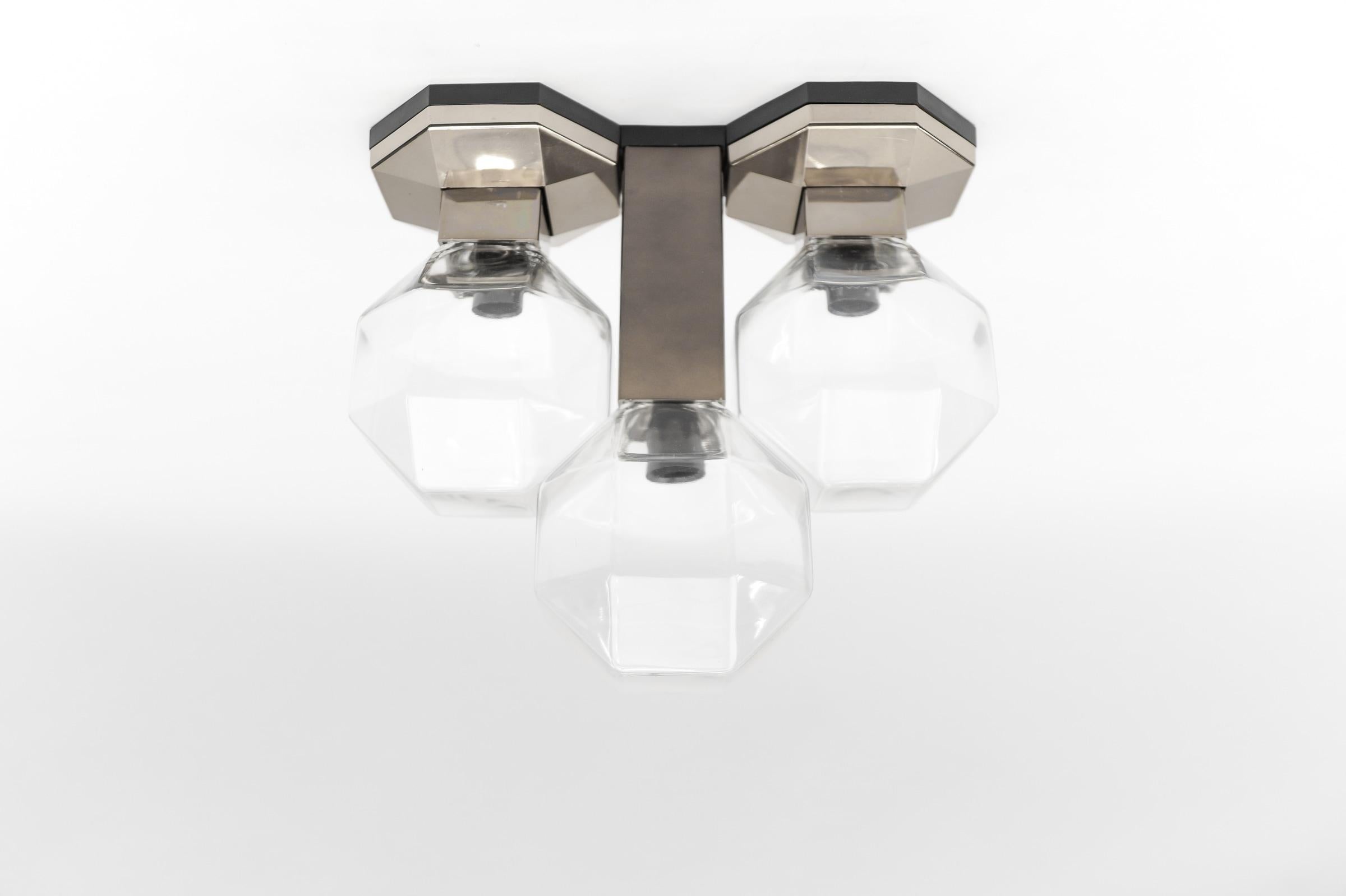 - Wall or flush mount ceiling lamp by Motoko Ishii for Staff Lighting Company
- 3 glass lights
- The lamp received the iF design award in 1974

The wall lamp come with 3 x E14 / E15 Edison screw fit bulb holder, is wired and in working condition. It