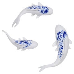 Wall or table decoration of three ceramic Delfts Blue swimming fish