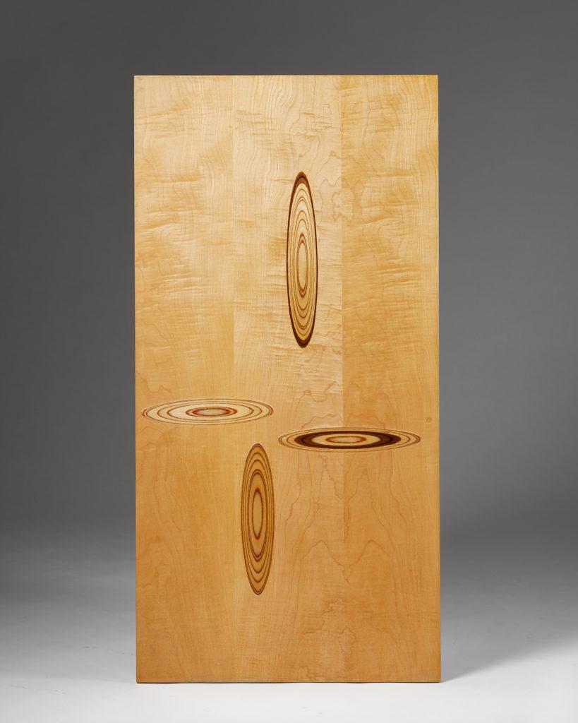 Veneer wood relief.

Tapio Wirkkala originally designed these panels as tabletops for the company Asko. He created several different marquetry patterns; some panels had a dark base and lighter inlays or, in this case, a light base with darker
