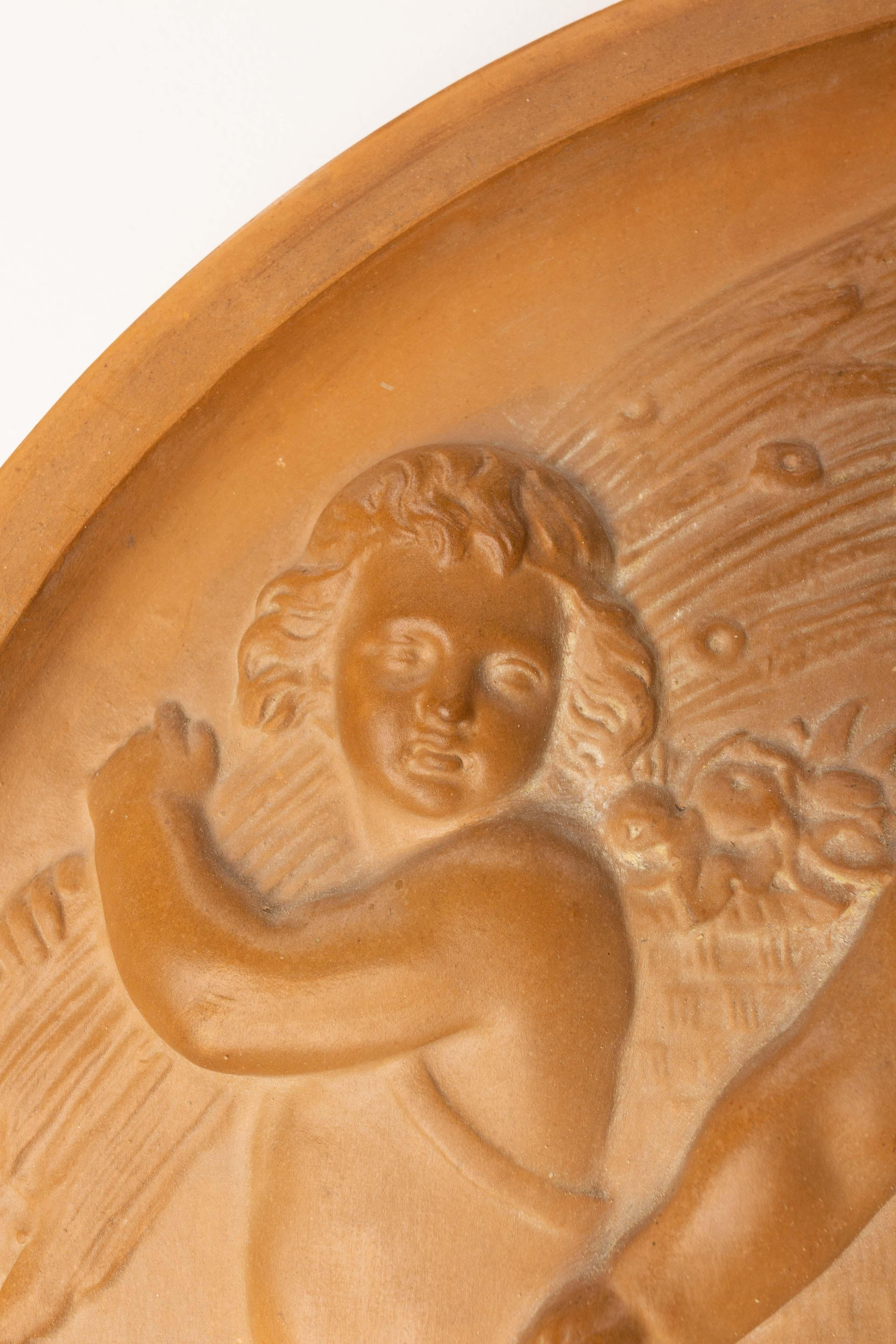 Terracotta Wall Plaque Sculpture Medallion Three Putti in Agricultural Scenes, circa 1920 For Sale