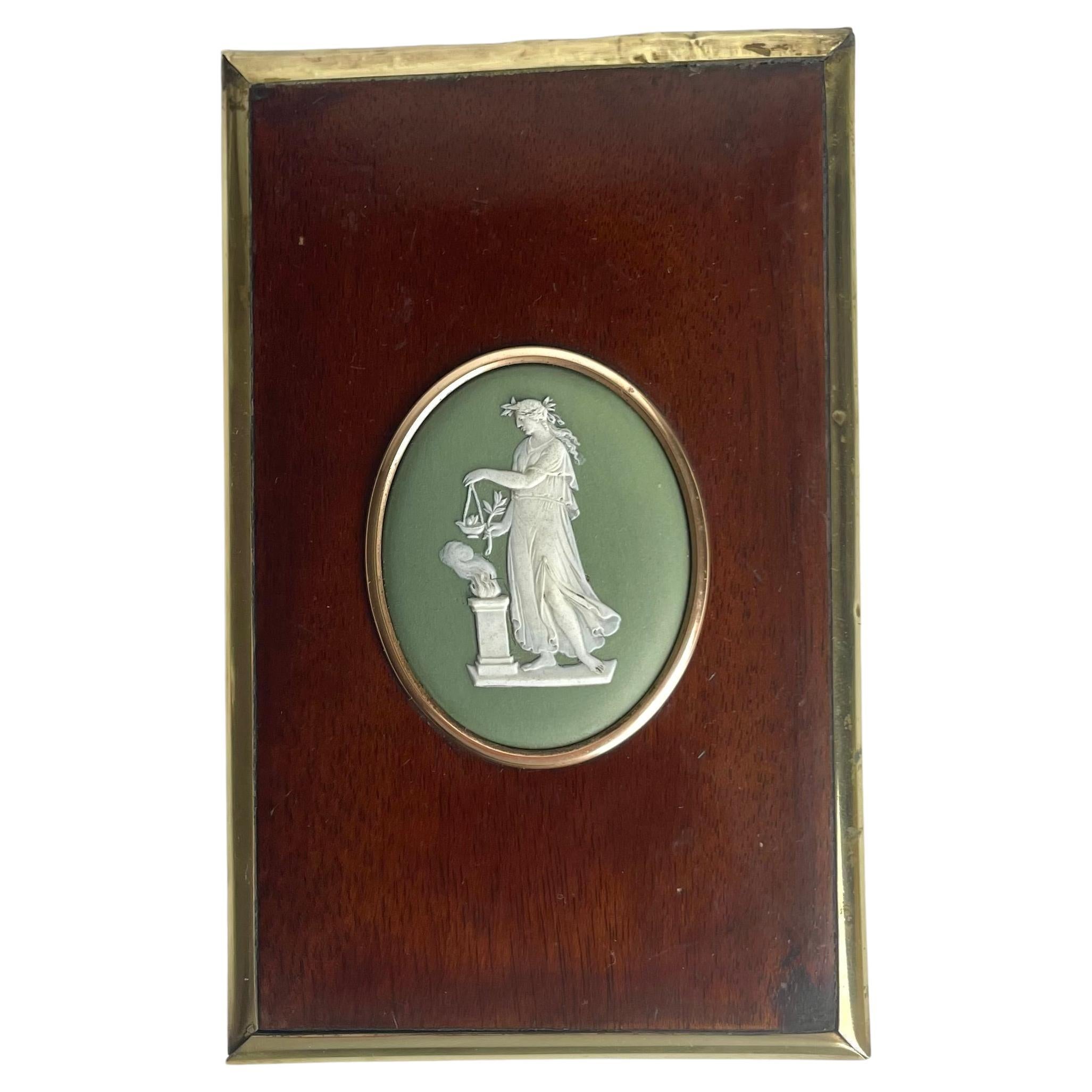 Wall Plaque with Wedgewood Medallion in a mahogany frame with brass decorations