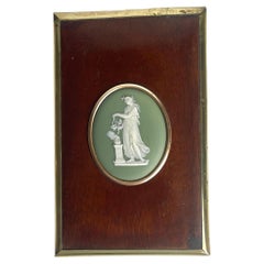 Wall Plaque with Wedgewood Medallion in a mahogany frame with brass decorations