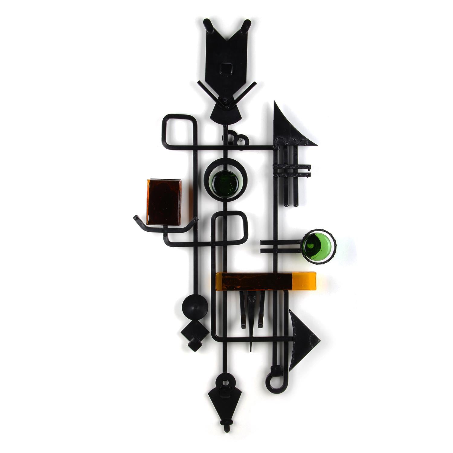 Wall relief by Dantoft Kunstartikler, Denmark, circa 1960s. Unique artisan work in welded metal with glass pieces in green and orange in excellent vintage condition.

Wondrous collage of imagination and geometric shapes - materialized in black,