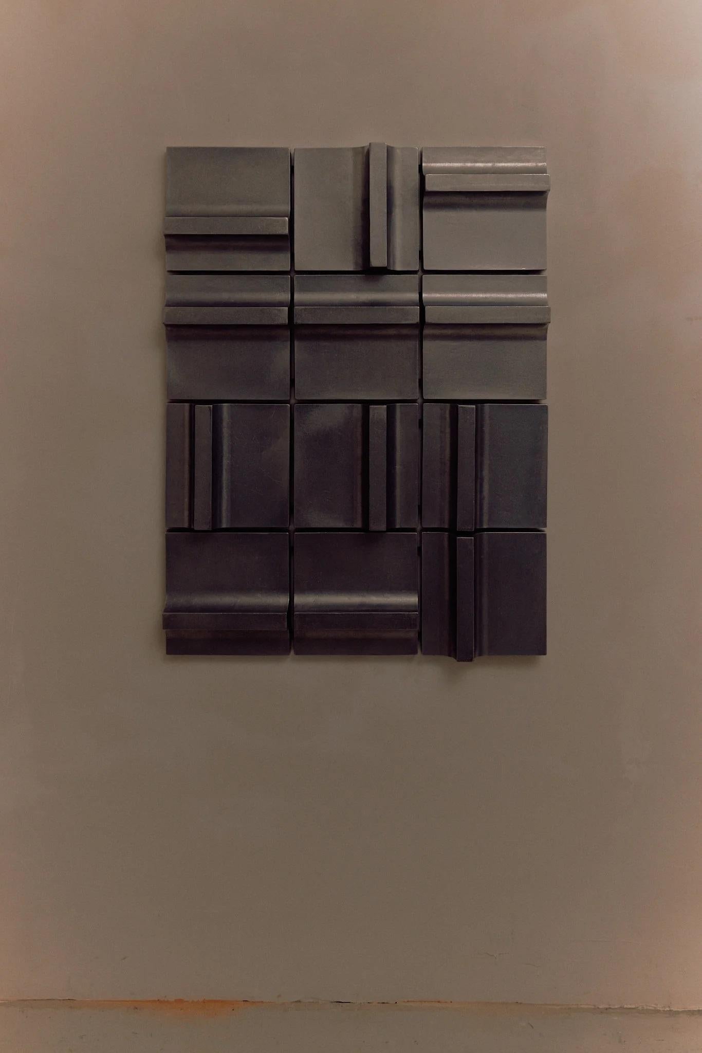Wall Relief Study 290 by Henry Wilson
Dimensions: W 91.5 x D 7.5 x H 122 cm
Materials: Aluminum.

A study in light and reflection, featuring cast aluminum tiles in configurations designed to capture and reflect ambient light, emphasizing the ways in