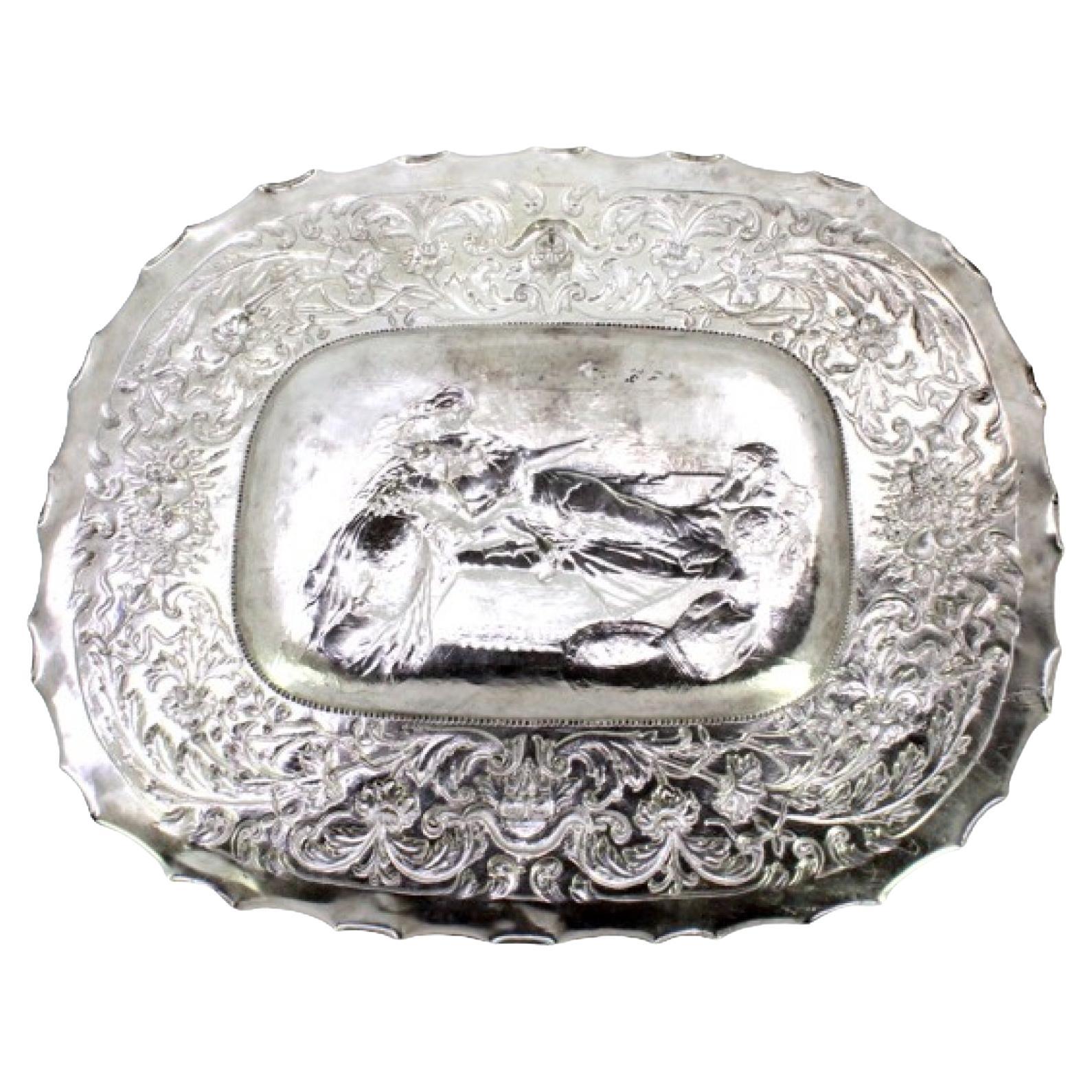 Wall salver in relief silver with an elliptical Biblical scene and wavy edge For Sale