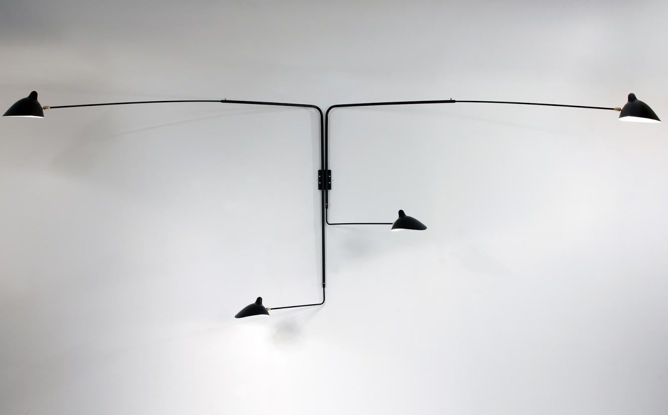 This sconce is designed so that one short and one long arm rotate at the same time creating a unique effect with illumination. Shades pivot in place. Switches located on mounting plate. Arm lengths to tip of shade 96