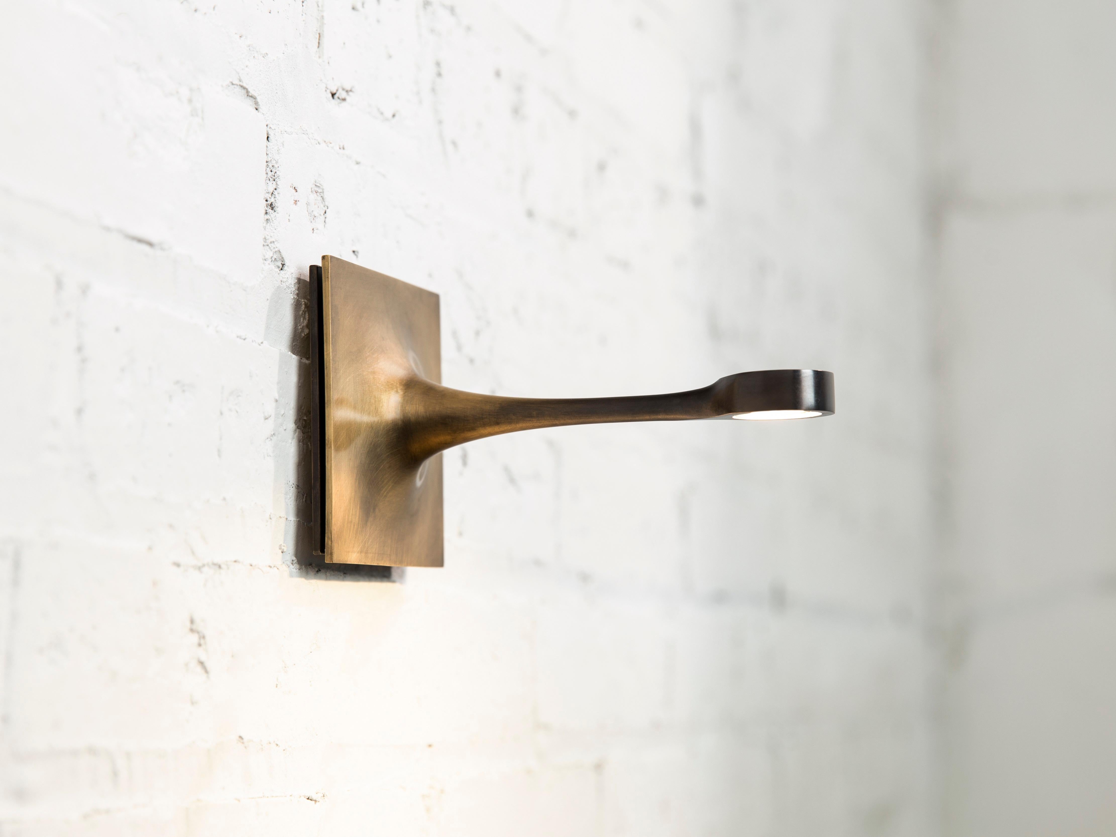 Wall sconce by Gentner Design
Dimensions: D 10 x W 16.5 x H 10 cm
Materials: brass

All our lamps can be wired according to each country. If sold to the USA it will be wired for the USA for instance.

I wanted to create the appearance of