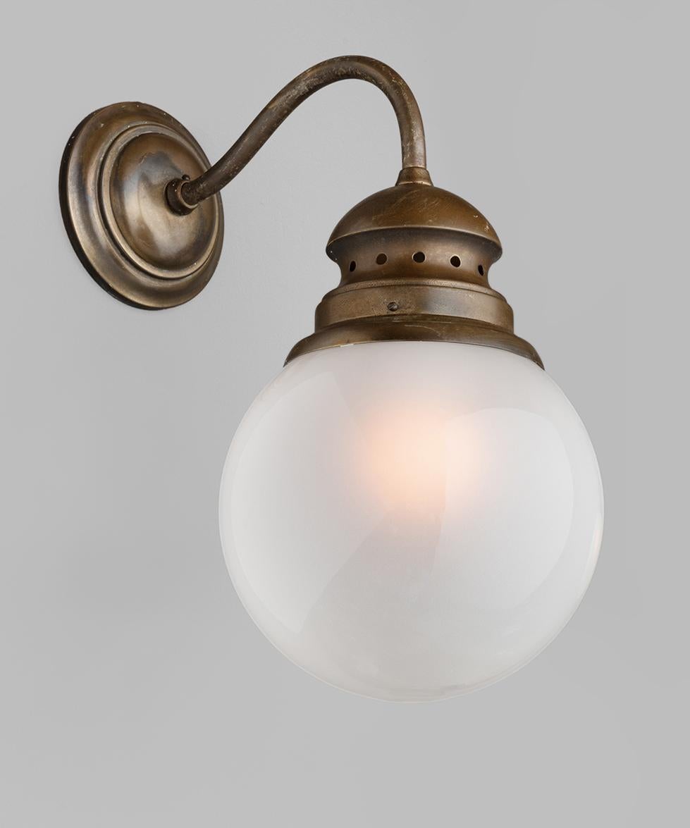 Wall sconce by Luigi Caccia Dominioni, Italy, circa 1950.

LP1 sconce by Dominioni created for Azucena. Naturally aged brass with original frosted glass globe.