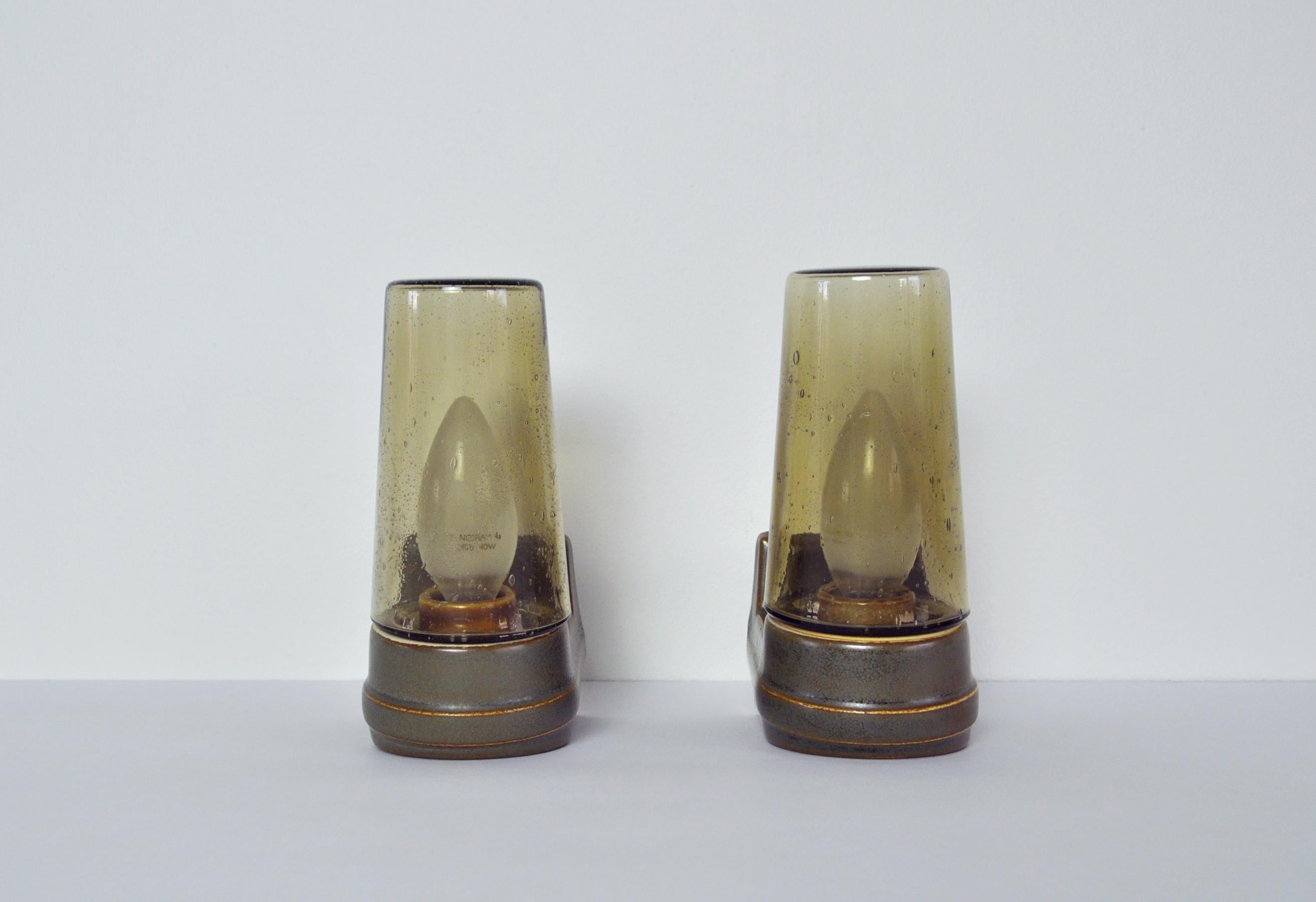 Scandinavian Modern glazed porcelain in green and brown tones combined with colored glass design by Sigvard Bernadotte for IFÖ, Sweden, 1960s.

Light source: E14 / E12 Edison screw fitting max 40W. Made for wet areas such as bathrooms, but