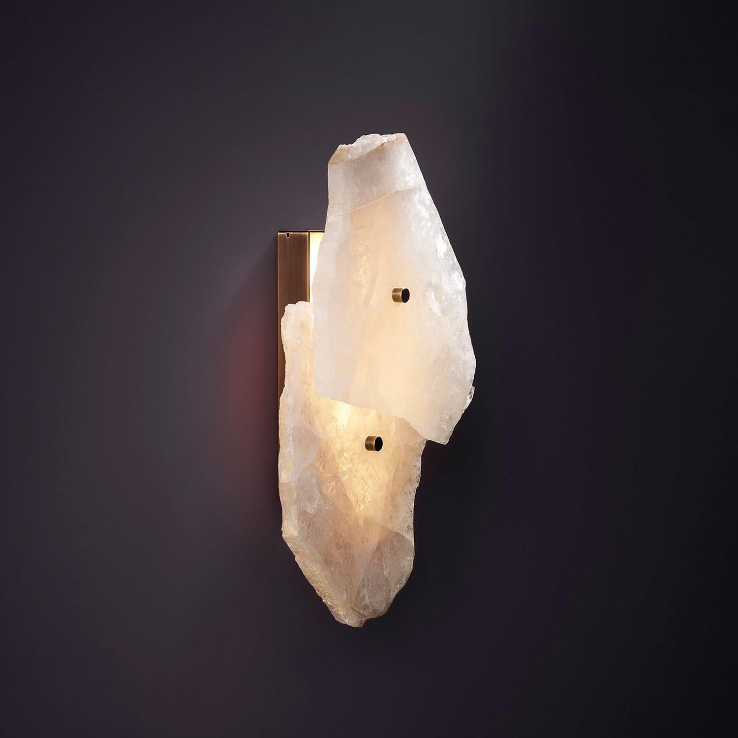 Contemporary Wall Sconce in Quartz with Brass Base - Petra I Twin by Christopher Boots

PETRA (from the Greek word ??t?a, meaning stone) celebrates the complexity and subtleties in the material composition in Quartz that PETRA is made