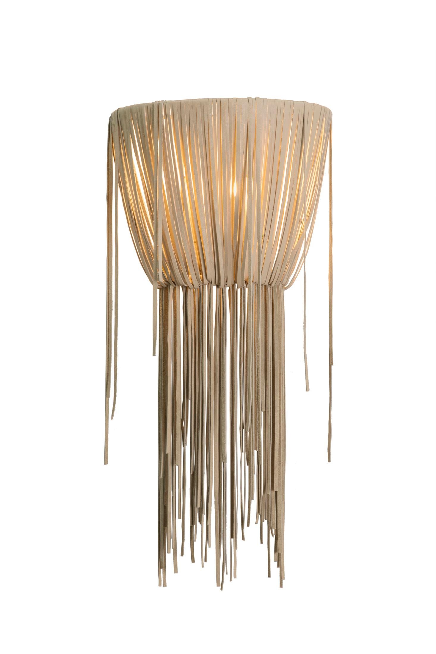 Our Urchin wall sconce features an elegant pattern of hand-cut leather strips. All hard-wired lighting is UL-listed for dry locations. Not suitable for outdoor use.

PRODUCT INFORMATION
DIMENSIONS: 15