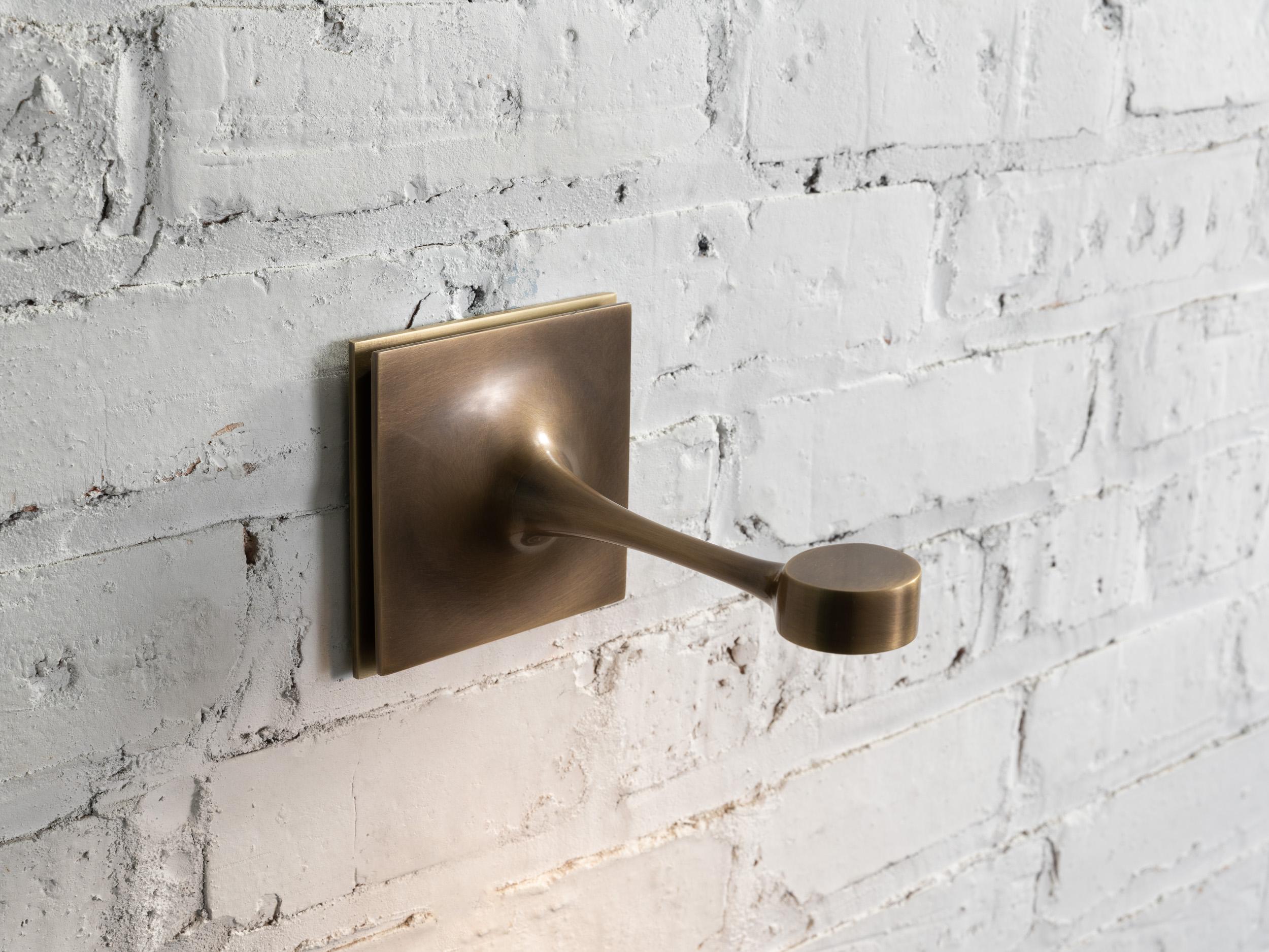 brass and bronze taper sconce