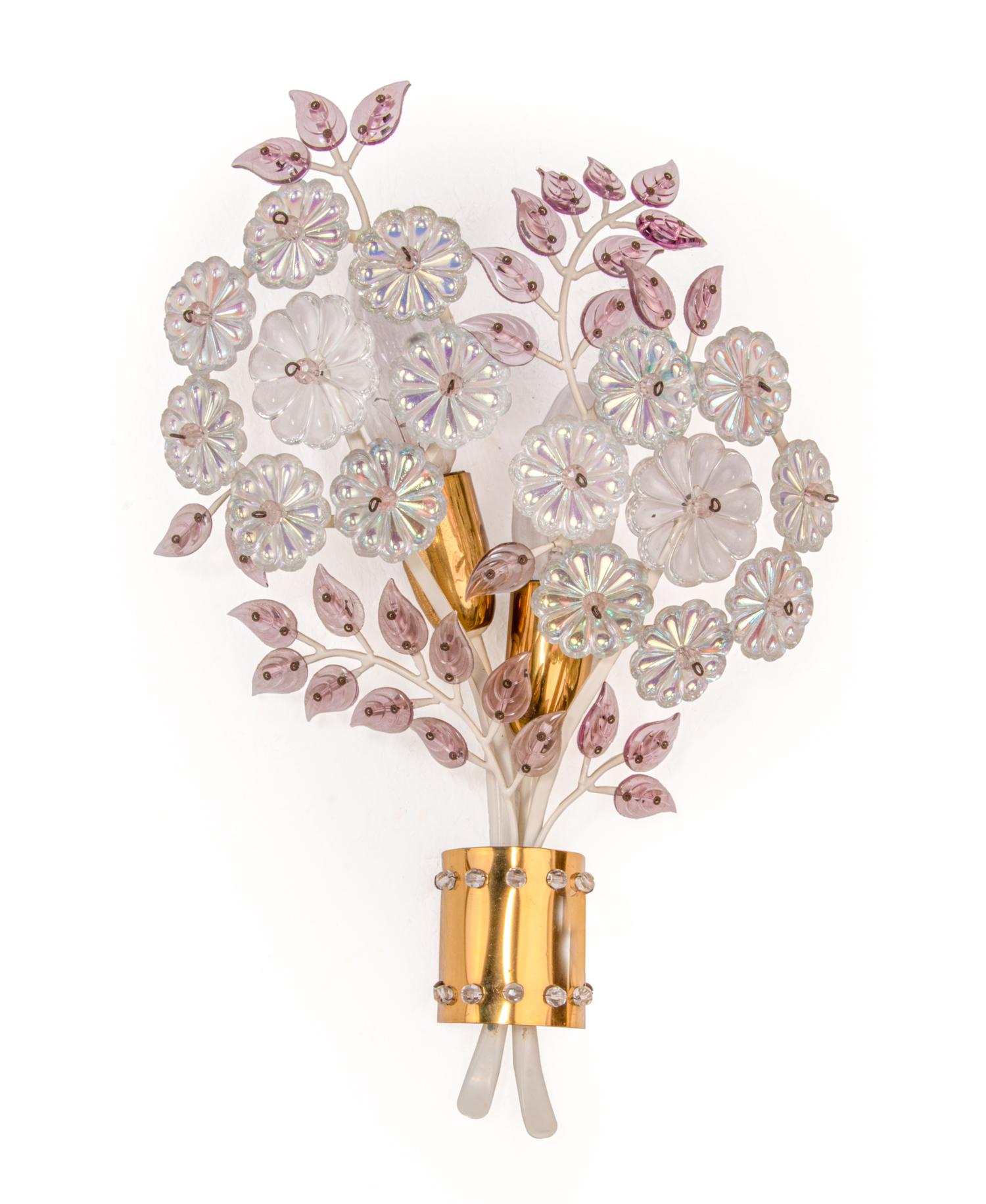 Charming wall sconce with and iridescent crystal flowers and amethyst petals on a white laquered and brass frame. 
This kind of lights were manufactured in the 50s by Oswald Haerdtl for Oswald Haerdtl for J. & L. Lobmeyr and Maison Baguès. 
