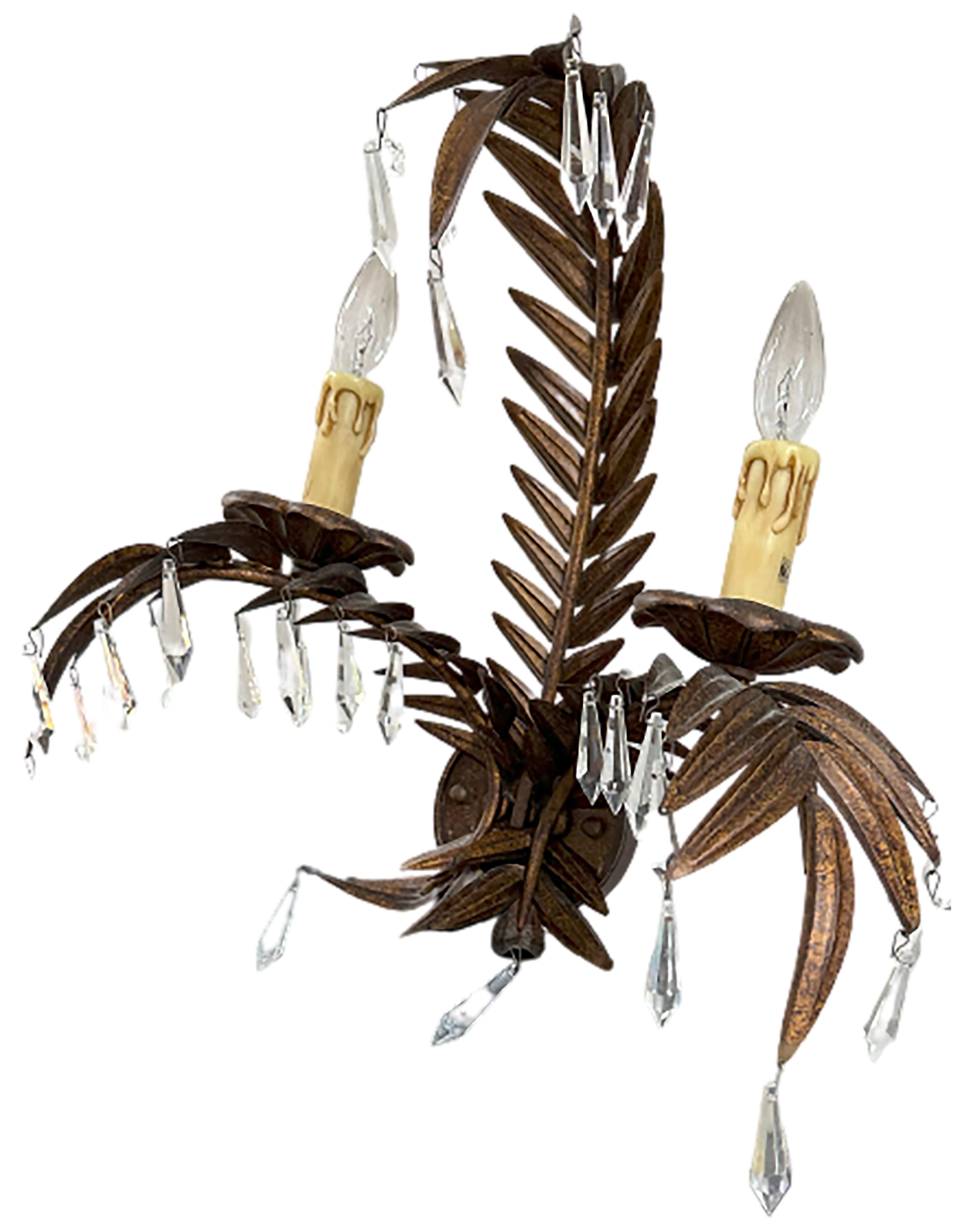 A handsome wall sconce. 21st century made. Hand cut glass crystal drops hanging from the palm fronds.

In good condition. Some gentle wear consistent with age and use.

No obvious markings on the piece. 

Would make a great addition to any living