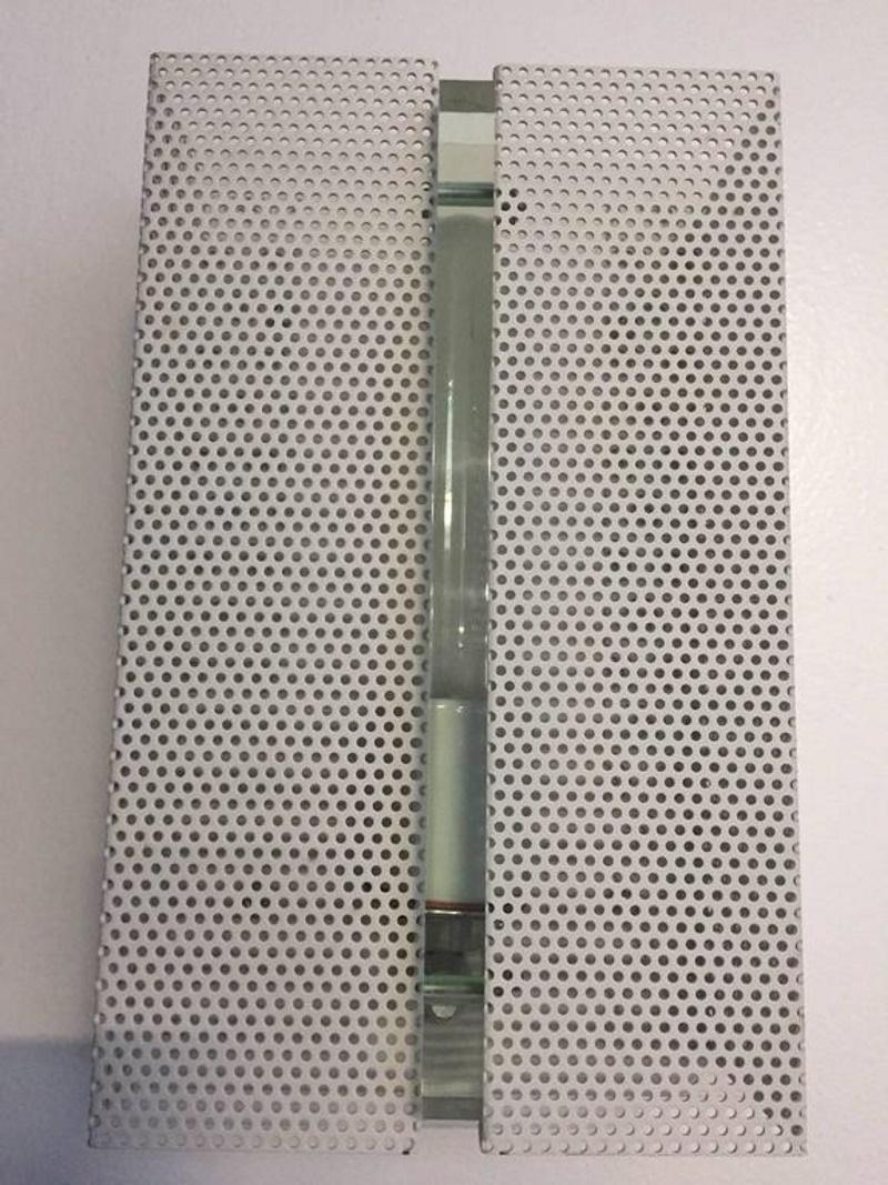 Wall sconce with perforated metal.  

Although this post indicates that there are 4 items in this set, the customer only wants 2 so the price has been adjusted from $4,500 to $2,500 for a set of 2.