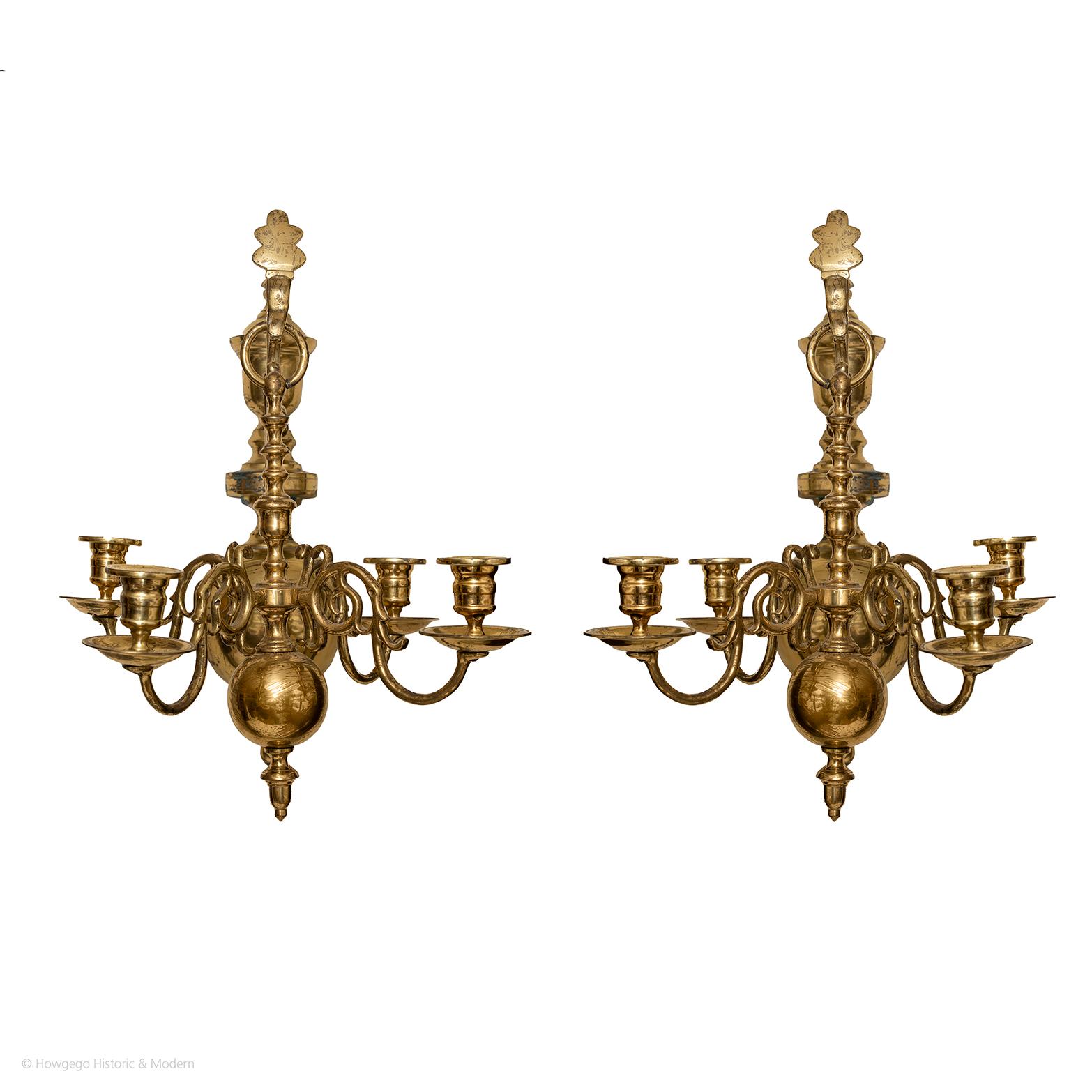 Rare pair of 19th century, antiquarian, dutch sconces in the baroque-style each holding a small 4-arm chandelier
-Versatile can be used as a wall sconce or hanging chandeliers
-Each chandelier has 4 candles throwing a lot of light into the