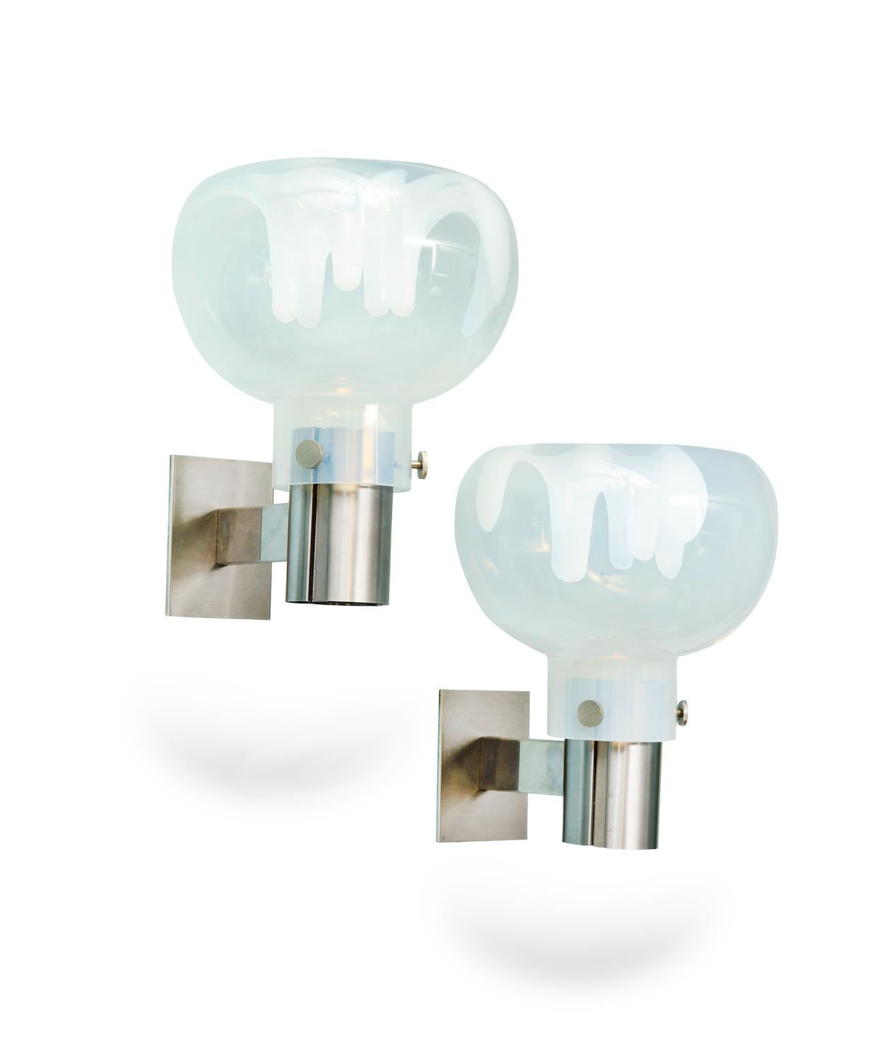 Hand blown Murano opaline glass shades with internal drips. Brushed steel structures and one candelabra socket per sconce.