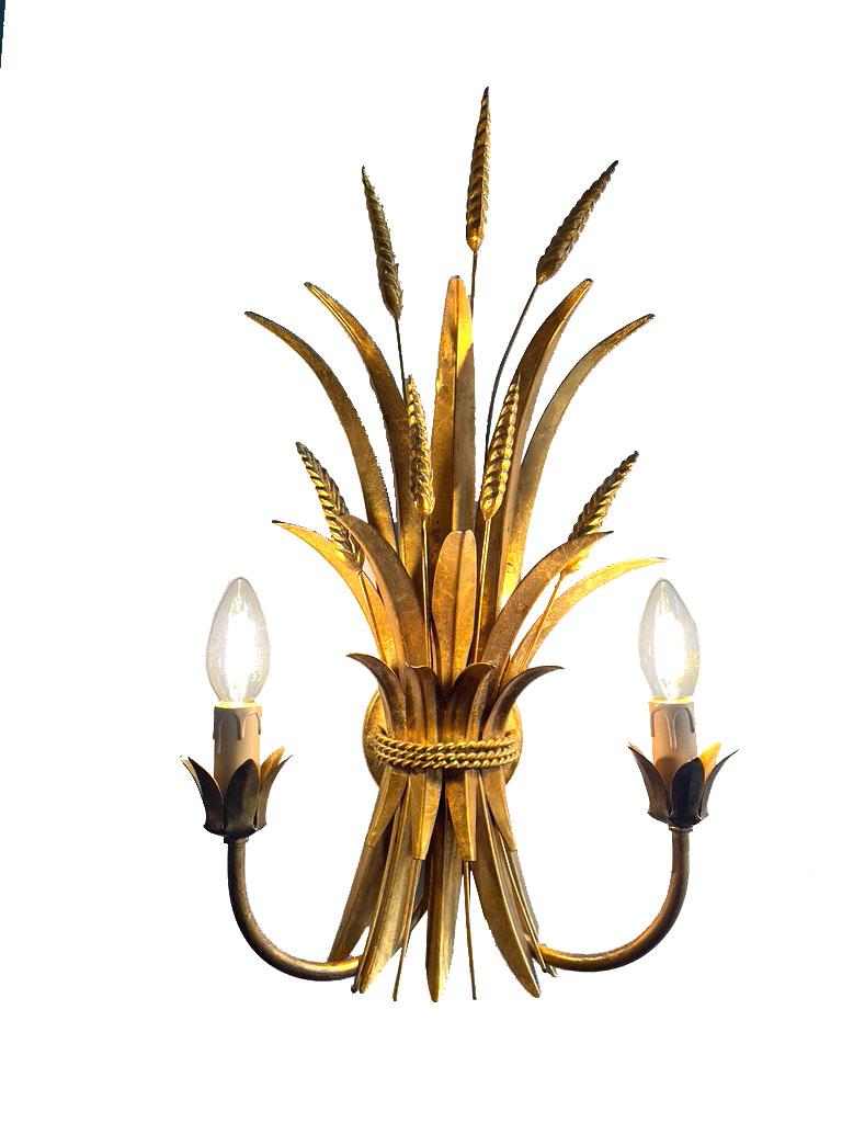 Wall sconces Coco Chanel
The gilt floral wall sconces are attributed to Coco Chanel and date back to the 1950s or 1960s. Coco Chanel was a famous French fashion designer known for her love of luxury and elegant design.

The wall sconces are made of