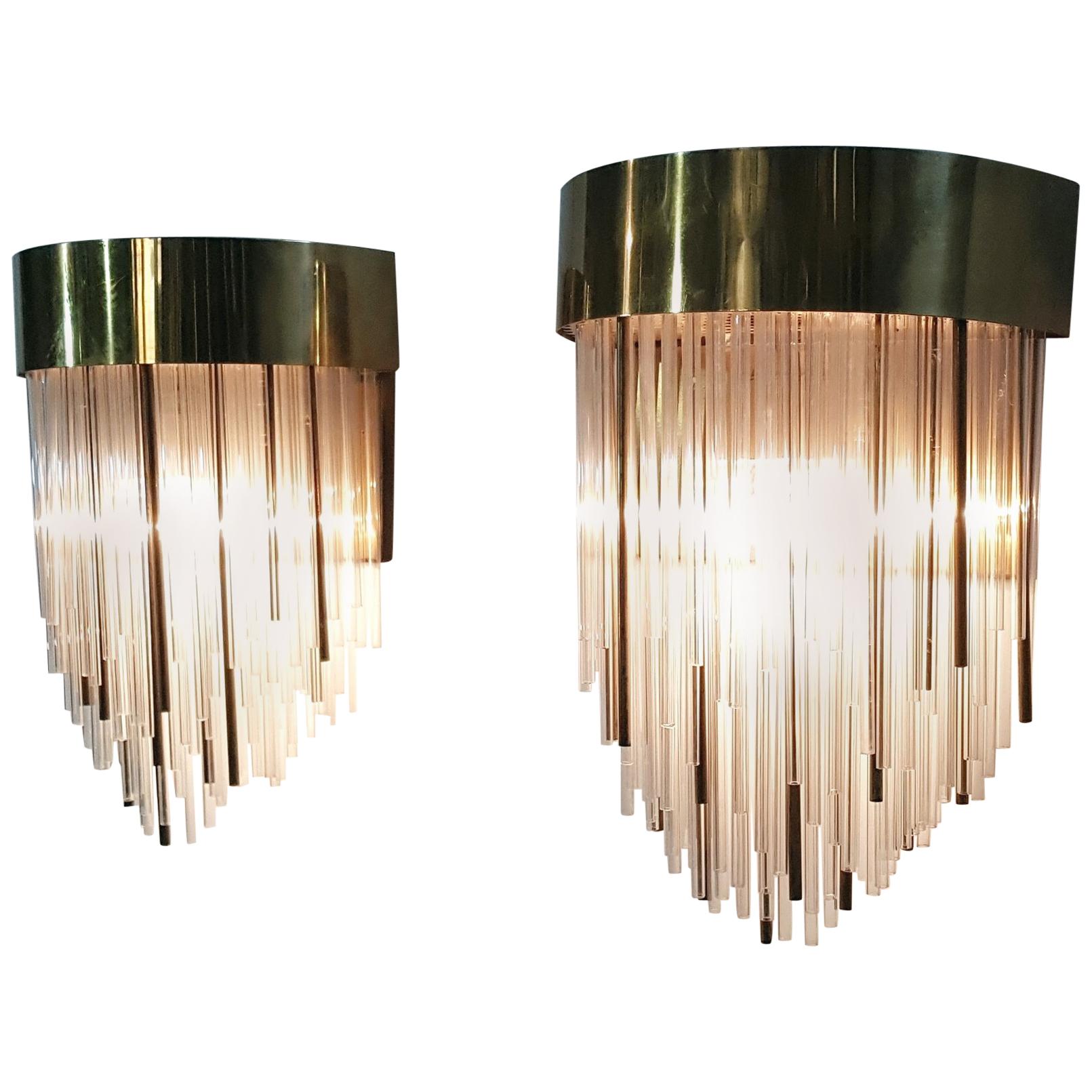 A pair of unusual and beautiful wall sconces with glass and brass 