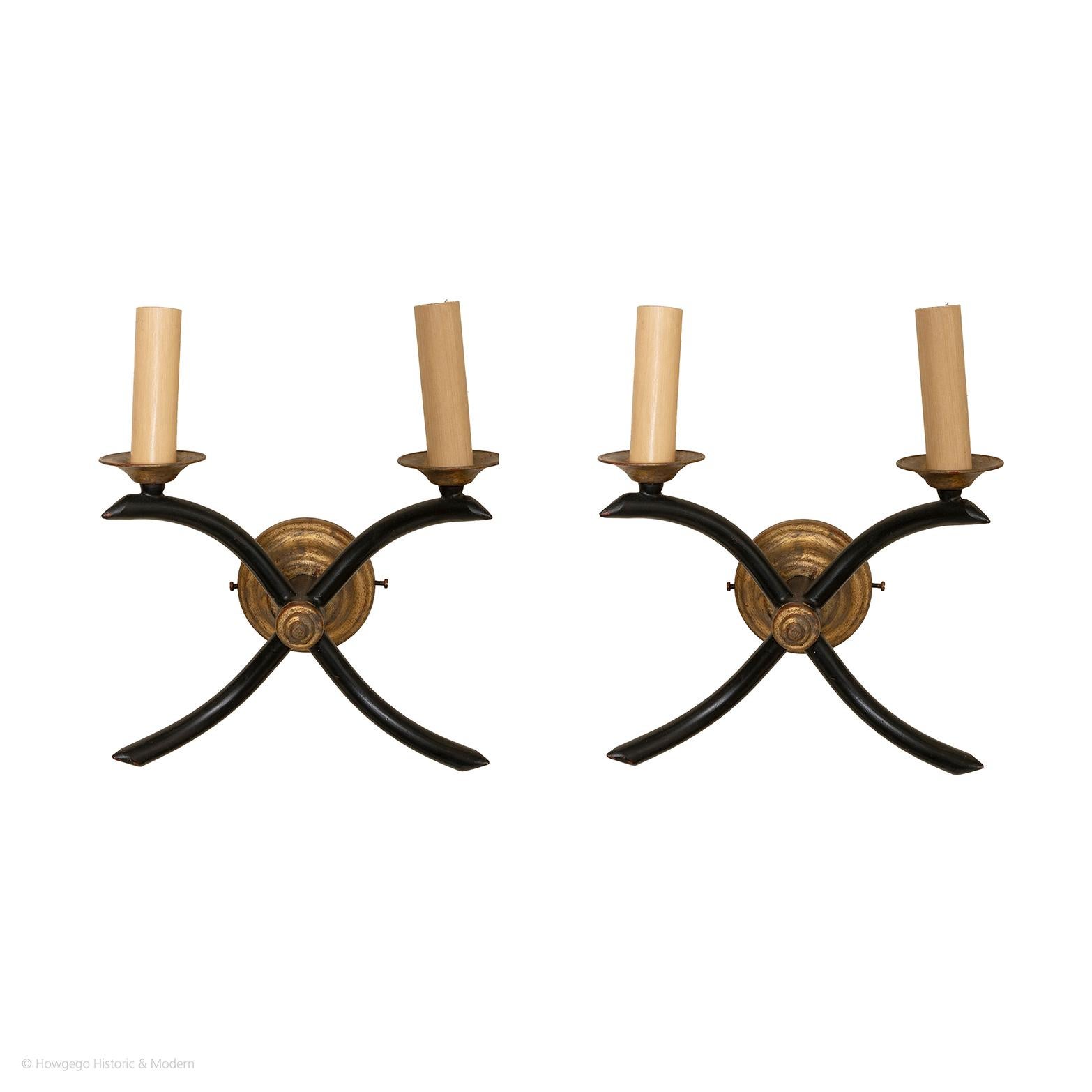 A PAIR OF VINTAGE, EMPIRE STYLE, GILDED & BLACK METAL WALL SCONCES, WITH TWO ARMS

- Striking, simple form accentuated by the contrast between the gilding and the black palette
- They blend and sit comfortably in period , modern and contemporary