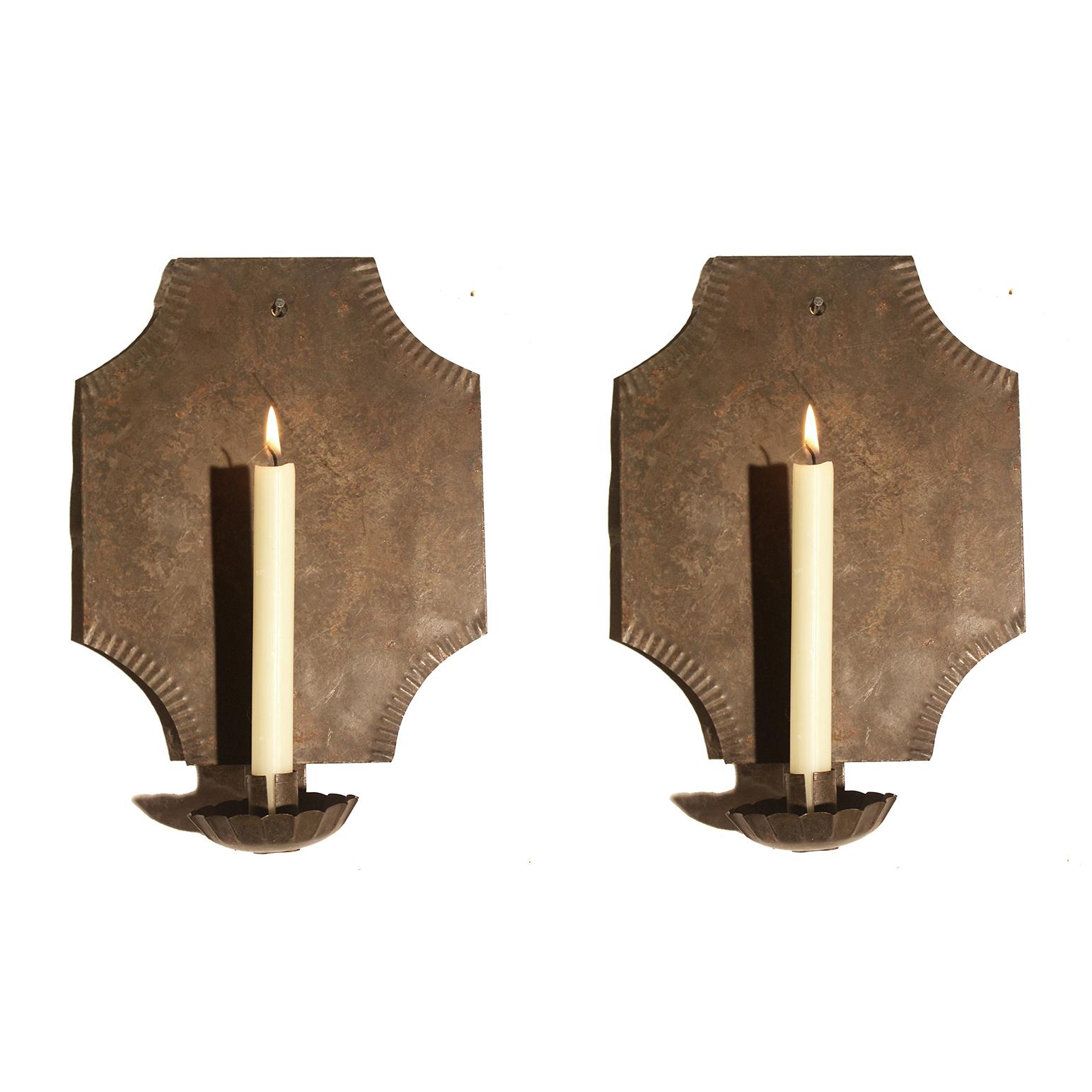 Surviving pieces of vernacular lighting are extremely rare and it is hard to source convincing re-creations. These are copies of a period sconce from The Card Room, Red Lion, Inn, Philadelphia and have a plausible antiqued patina.

SIngle candle