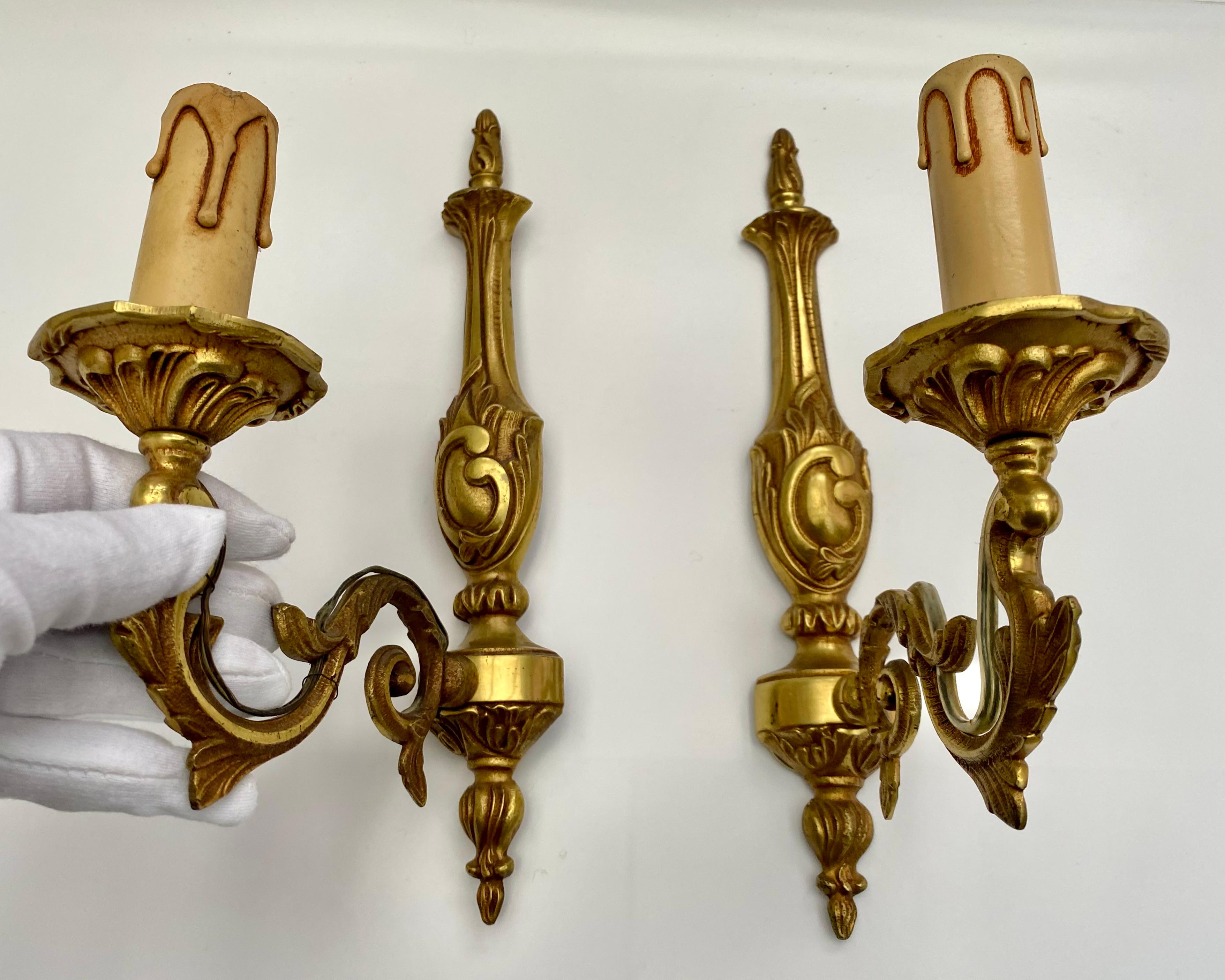 Pair of Mid-Century Modern French Bronze Wall Sconces - NF Marked - 1960s

Add a touch of sophisticated mid-century modern style to your home with this exquisite pair of vintage French wall sconces.

These stunning pieces, dating back to the 1960s,