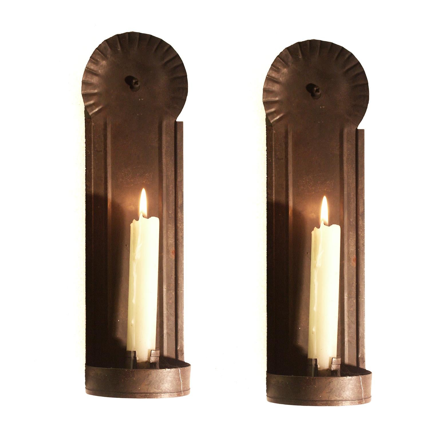 Surviving pieces of vernacular lighting are extremely rare and it is hard to source convincing re-creations. These are copies of a period sconce from Longfellows Wayside Inn S Sudbury MA and have a plausible antiqued patina.

SIngle candle tin